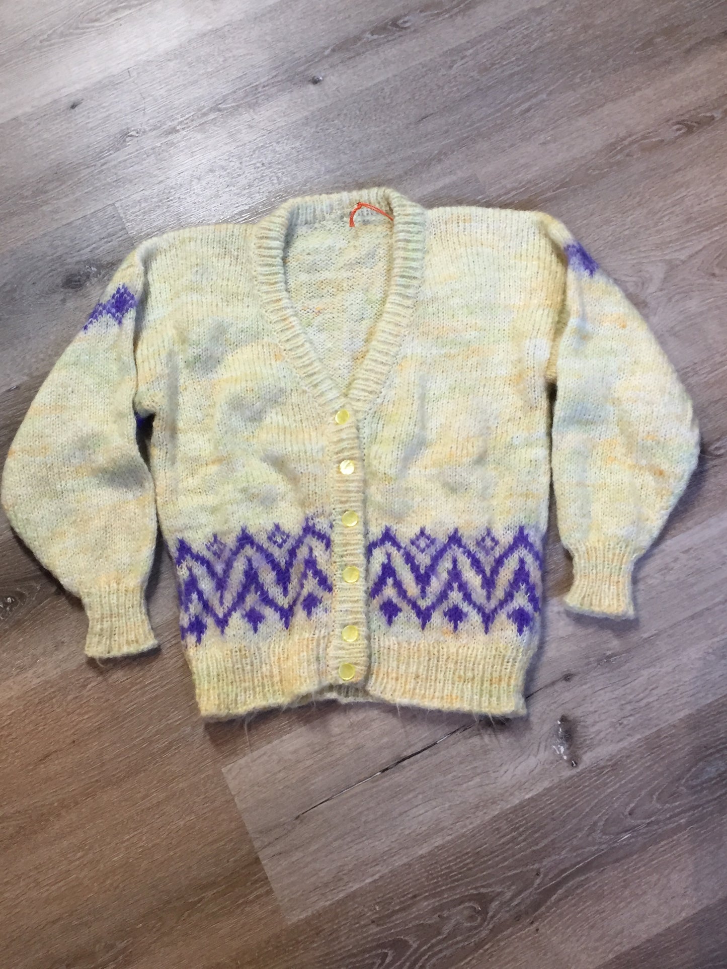 Kingspier Vintage - Hand knit cardigan in pale yellow with purple design and button closures. Size medium.