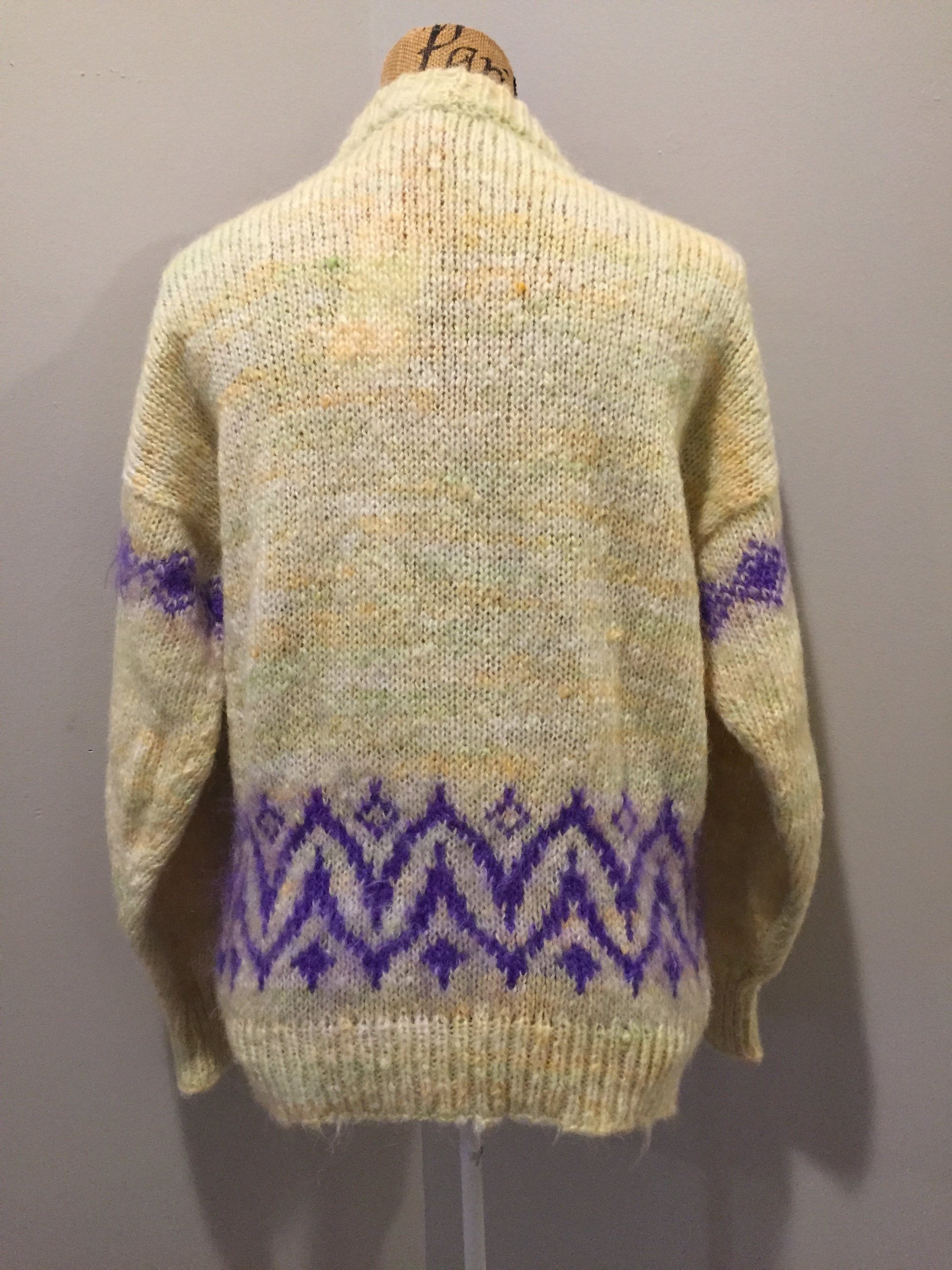 Kingspier Vintage - Hand knit cardigan in pale yellow with purple design and button closures. Size medium.