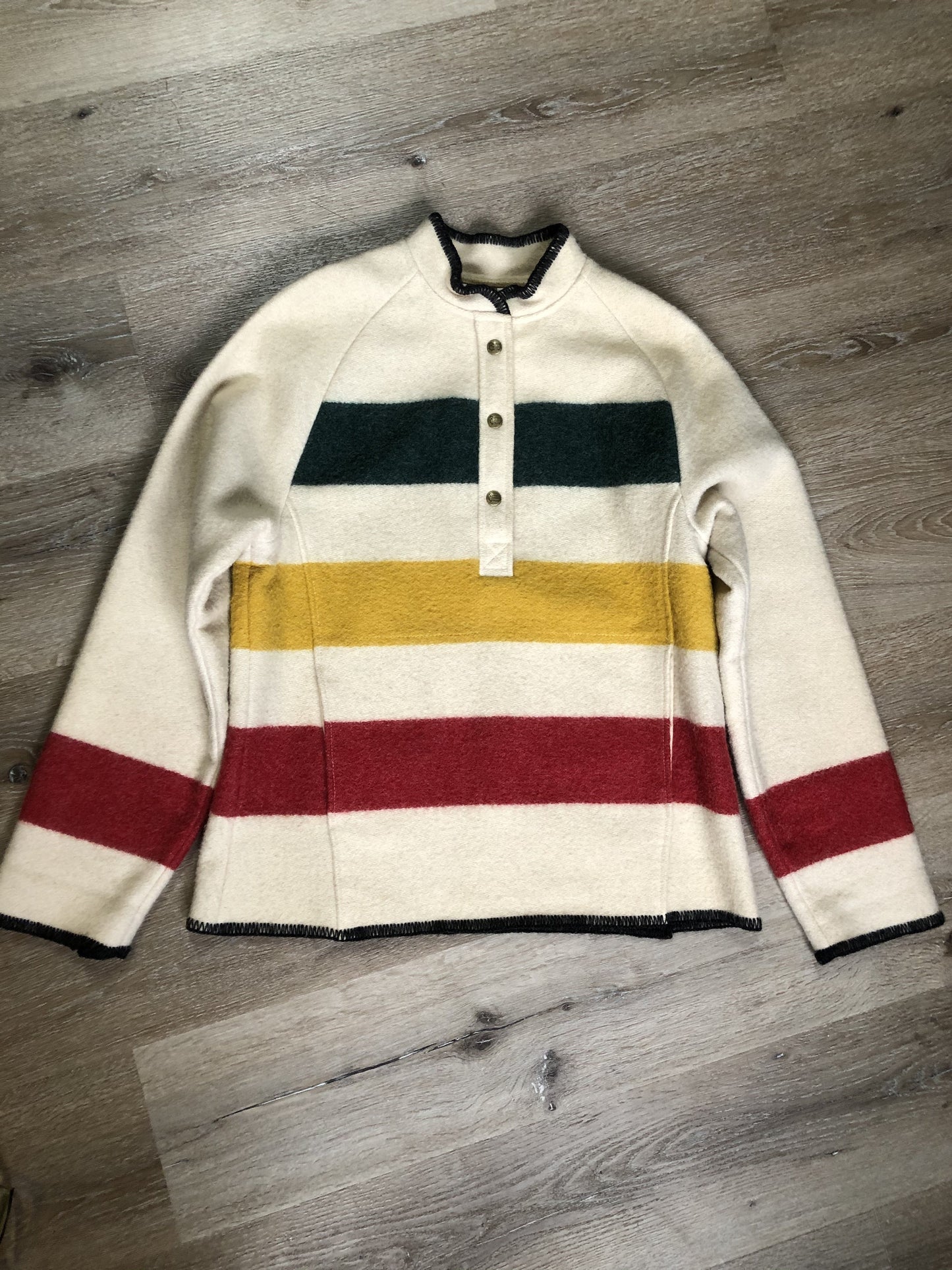 Kingspier Vintage - Woolrich 1970's wool half snap blanket sweater with green. red and yellow stripe. This sweater features half snap closures and a pouch pocket in the front.