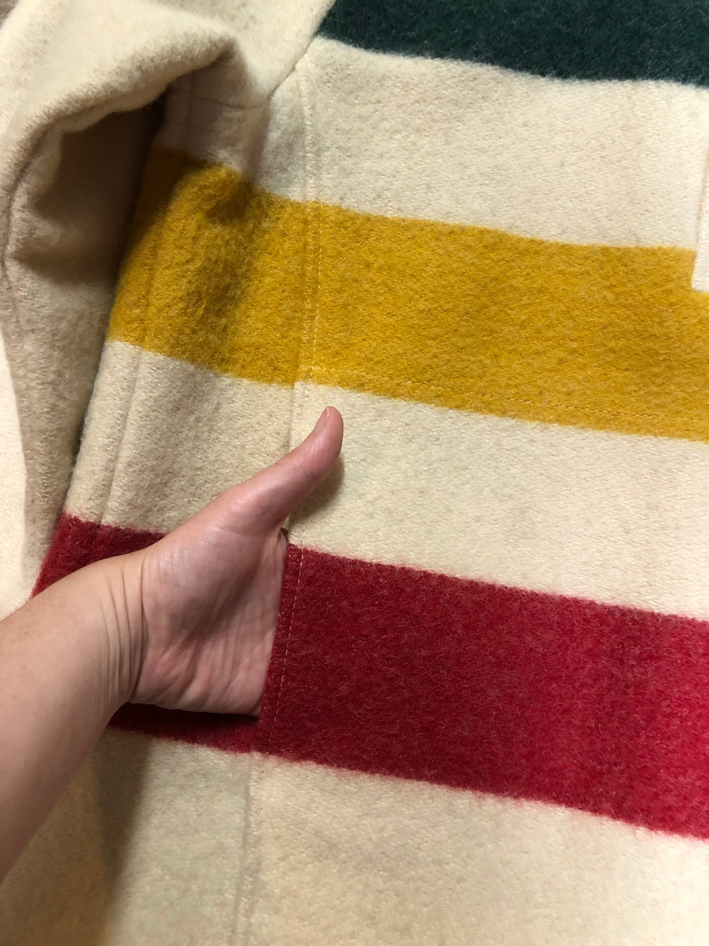 Kingspier Vintage - Woolrich 1970's wool half snap blanket sweater with green. red and yellow stripe. This sweater features half snap closures and a pouch pocket in the front.