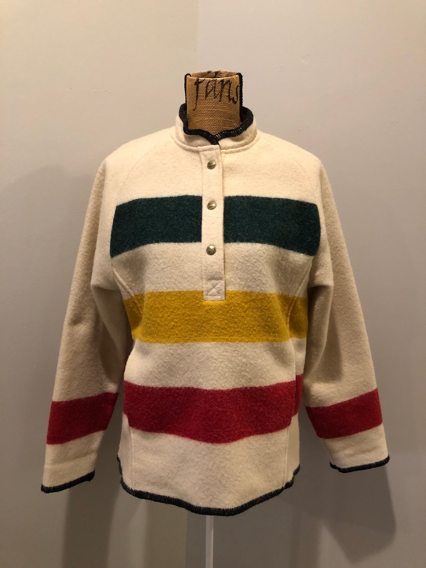Kingspier Vintage - Woolrich 1970's wool half snap blanket sweater with green. red and yellow stripe. This sweater features half snap closures and a pouch pocket in the front.