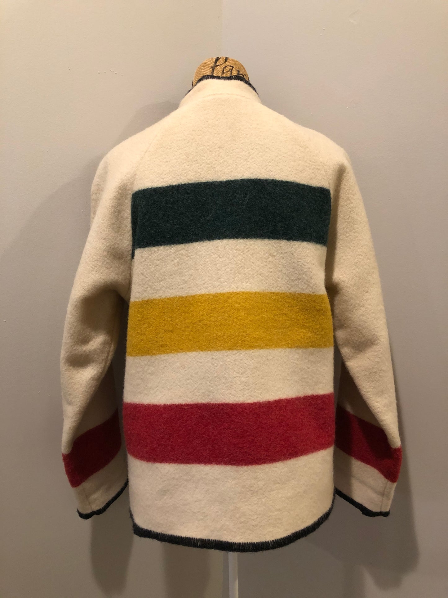 Kingspier Vintage - Woolrich 1970's wool half snap blanket sweater with green. red and yellow stripe. This sweater features half snap closures and a pouch pocket in the front.