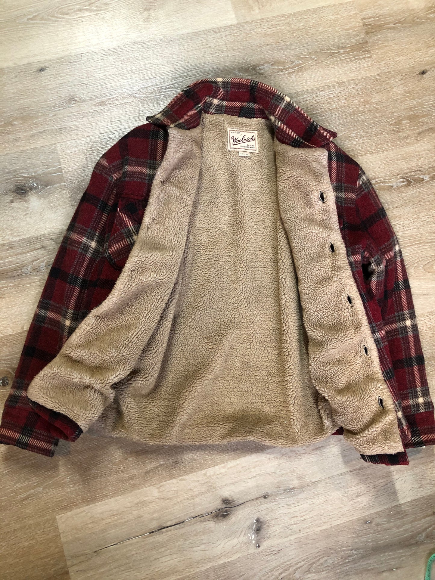 Kingspier Vintage - Woolrich Rugged Outdoor Wear red plaid wool jacket with button closures, two flap pockets and a fleece lining. Made in the USA. Size large.