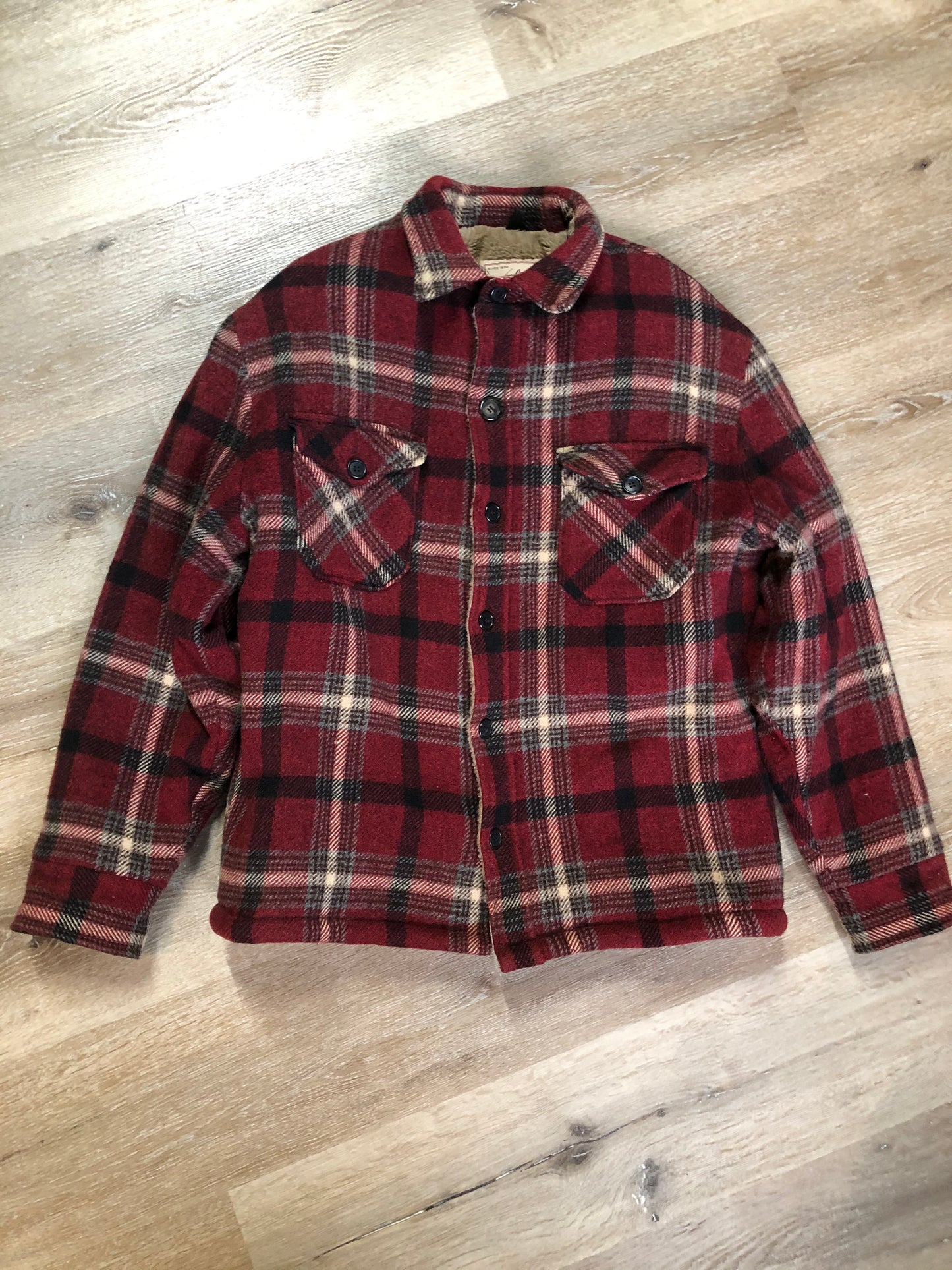 Kingspier Vintage - Woolrich Rugged Outdoor Wear red plaid wool jacket with button closures, two flap pockets and a fleece lining. Made in the USA. Size large.