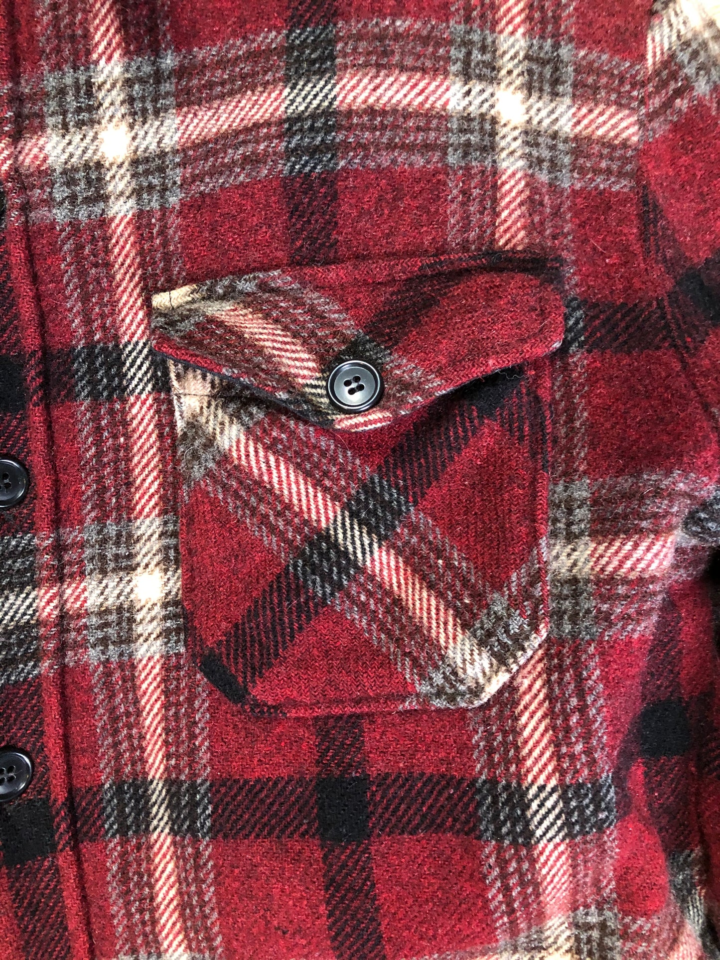 Kingspier Vintage - Woolrich Rugged Outdoor Wear red plaid wool jacket with button closures, two flap pockets and a fleece lining. Made in the USA. Size large.