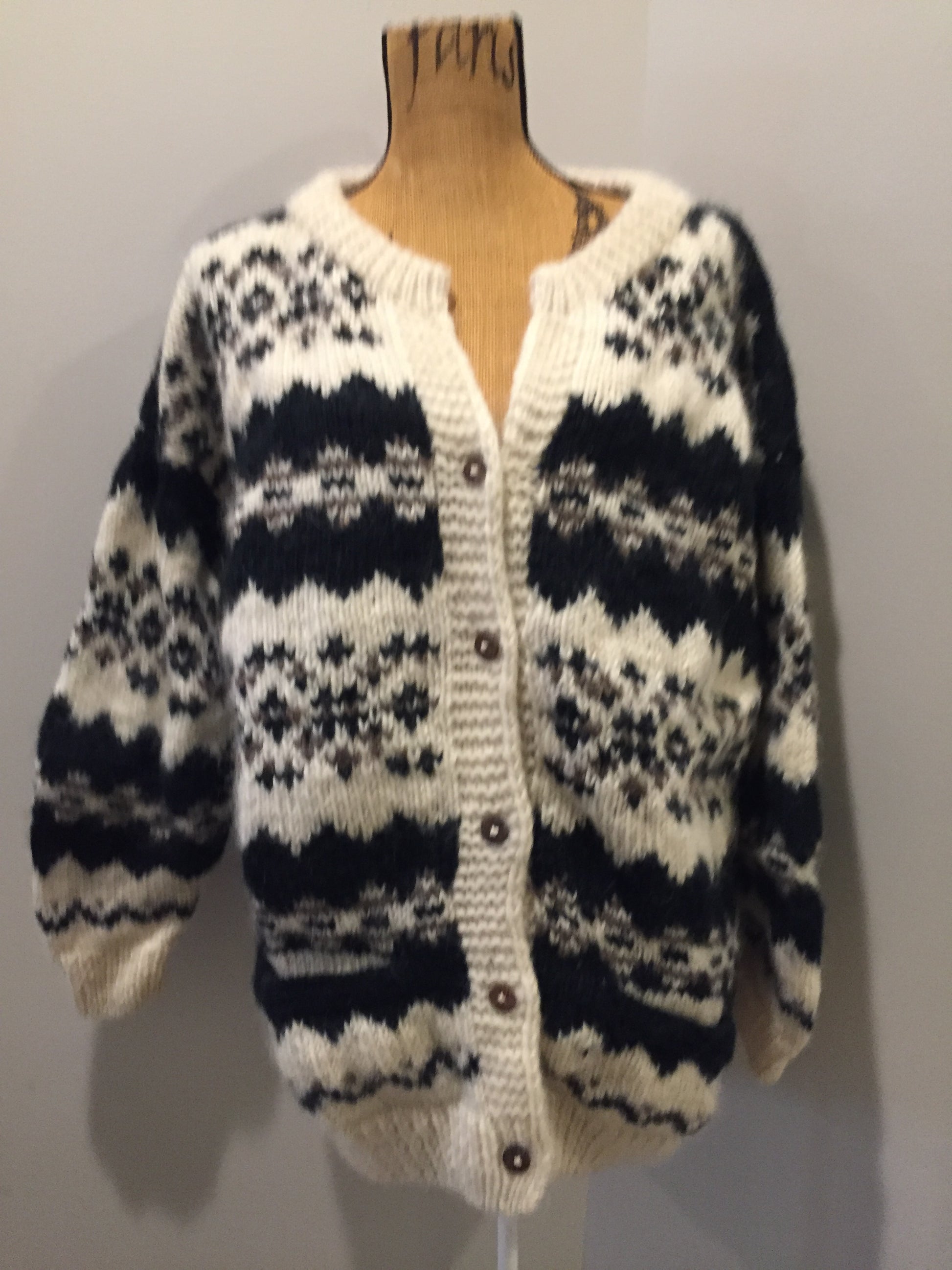 Kingspier Vintage - Vintage Casbah Imports wool cardigan in cream, black and brown with button closures and pockets. Size XXL.