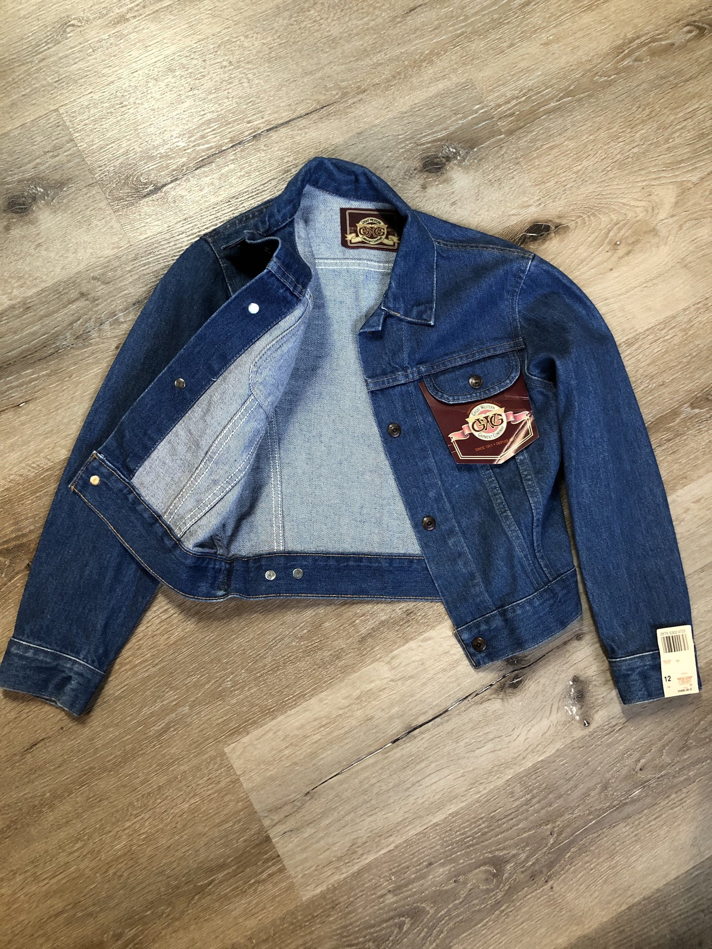 Kingspier Vintage - GWG (Great Western Garment Co.) denim jacket in a medium wash with snap closures and two flap pockets on the chest. Says size 12 fits XS. Canadian company.