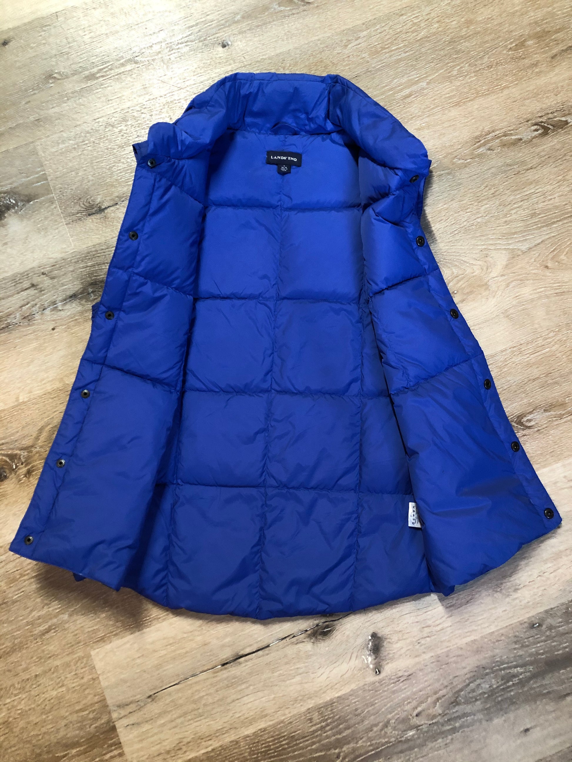 Kingspier Vintage - Land’s End blue down filled puffer vest with snap closures and slash pockets. Size small.