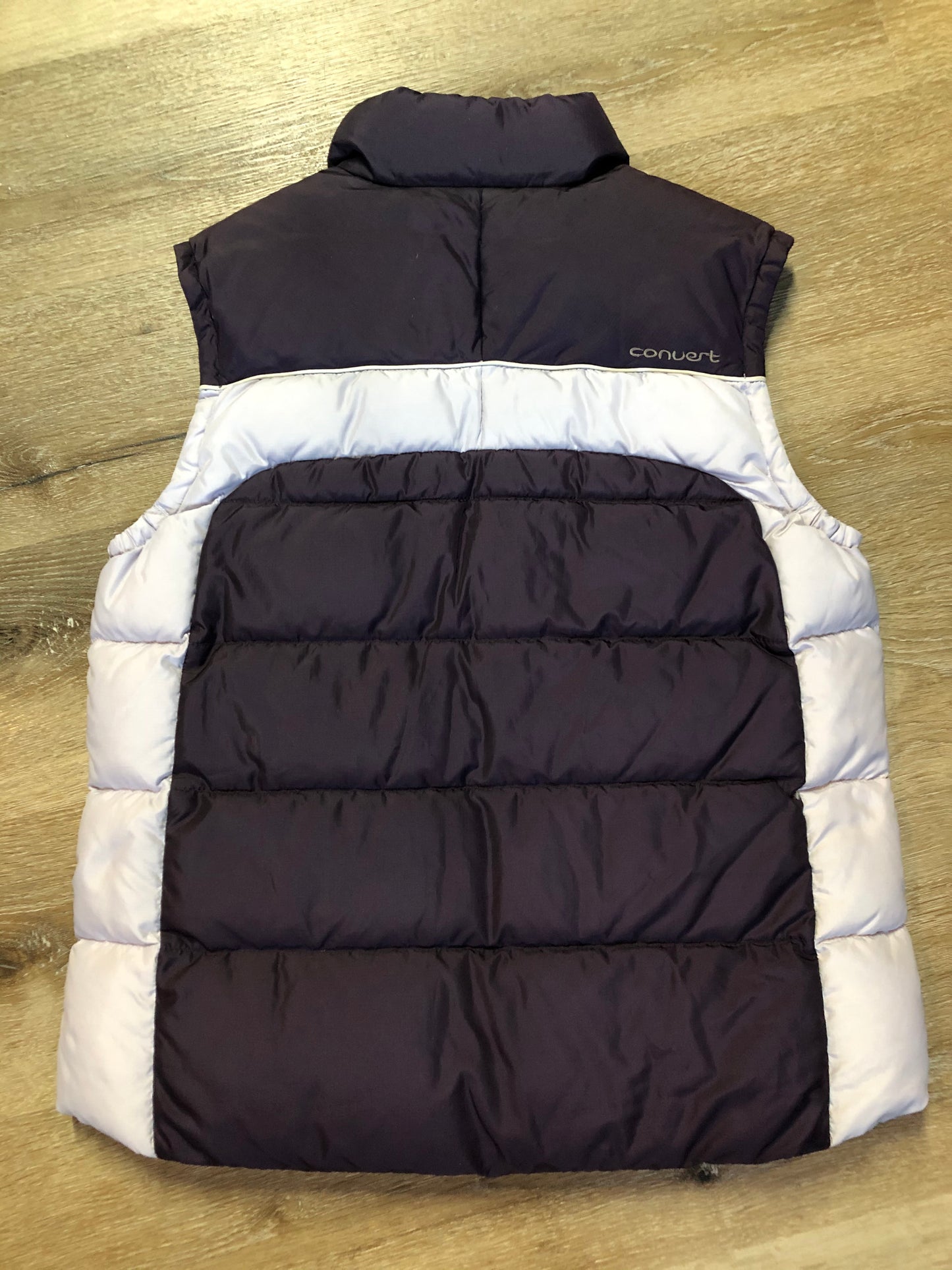 Kingspier Vintage - Columbia dark and light purple down filled puffer vest with zipper closure, vertical zip pockets and inside pocket. Size large.
