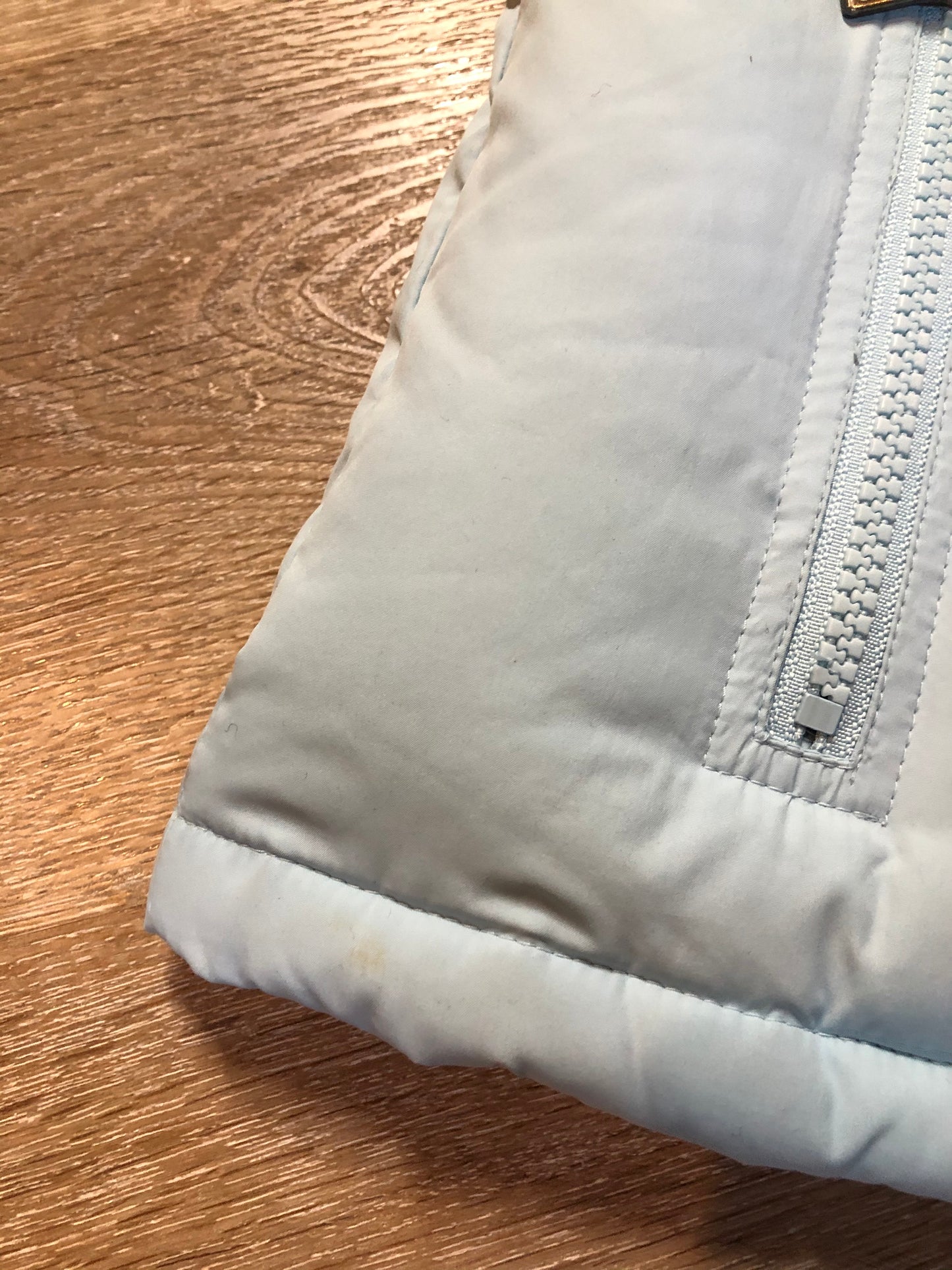 Kingspier Vintage - Alpinetek baby blue down filled puffer vest with zipper and snap closures, vertical zip pockets. Size large.