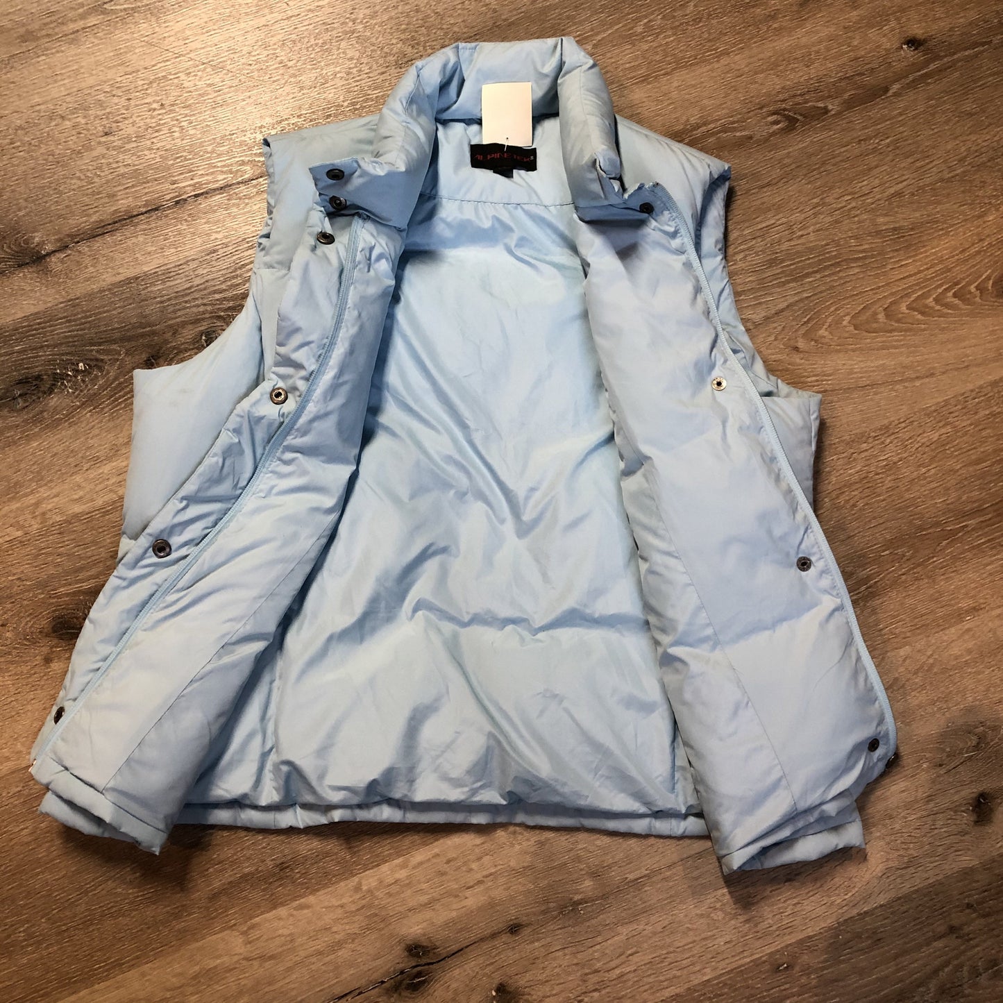 Kingspier Vintage - Alpinetek baby blue down filled puffer vest with zipper and snap closures, vertical zip pockets. Size large.