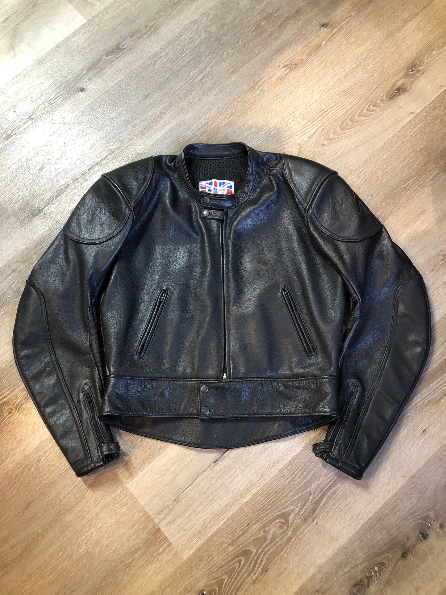 Kingspier Vintage - Vintage MW Leathers black full grain leather motorcycle jacket with mesh lining,snap collar, zipper closure, zip pockets and am inside pocket.
