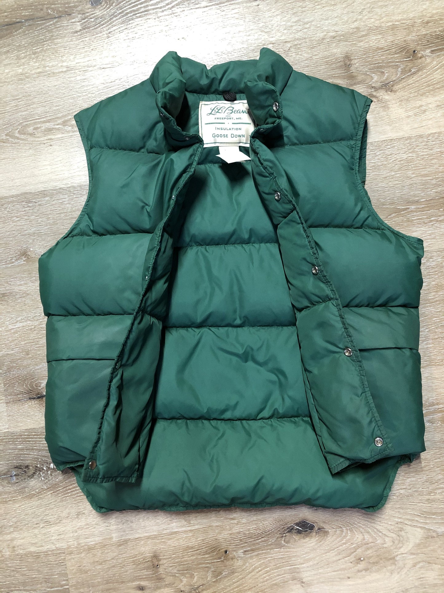 Kingspier Vintage - L.L.Bean forest green down filled puffer vest with snap closures, patch pockets and is longer in the back.