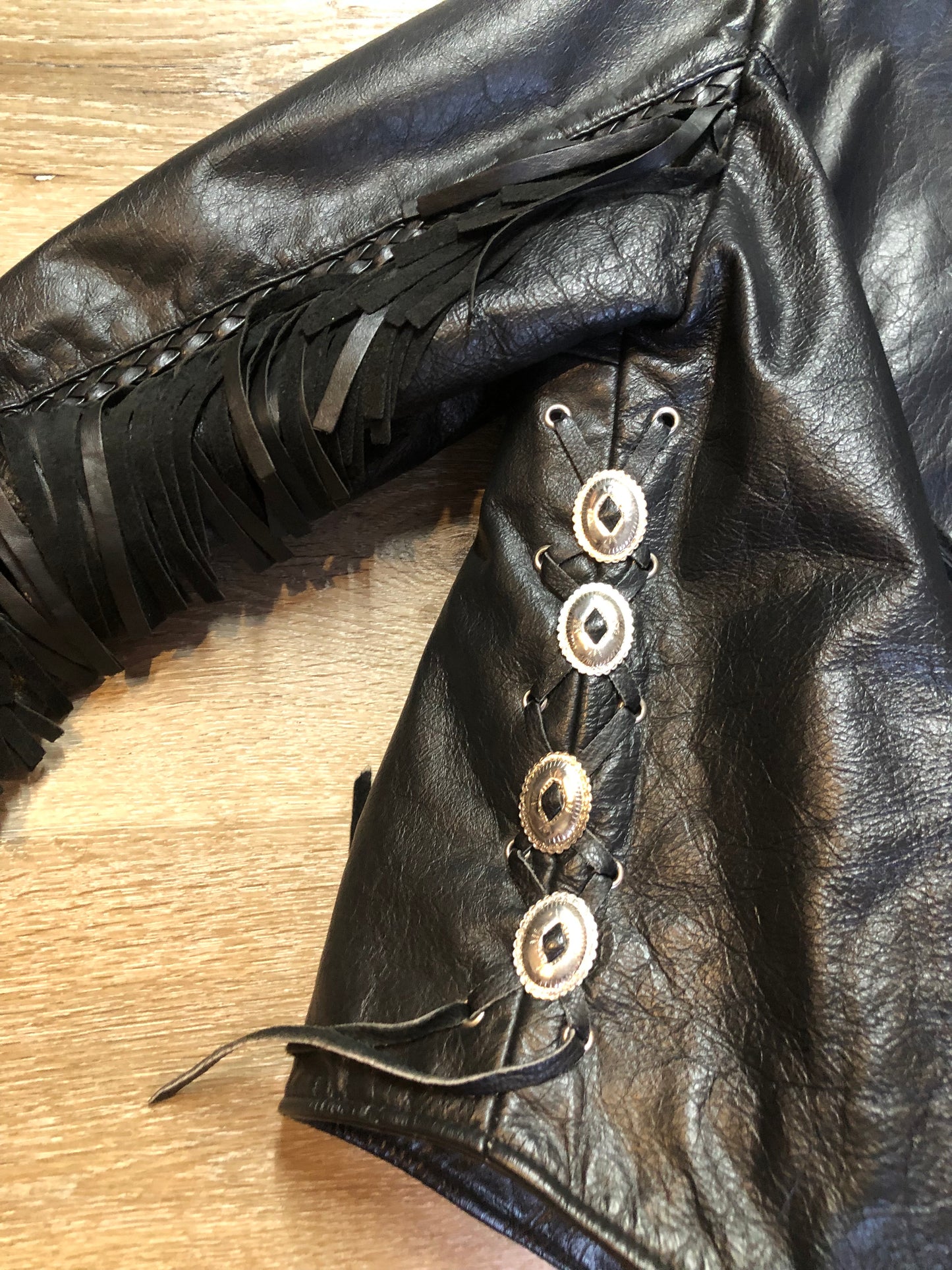 Kingspier Vintage - Vintage 1980’s Bristol “Golden Crown” black leather motorcycle jacket with leather fringe, suede rose applique in the front and back, silver hardware, lace up sides zipper closure, zip pockets and a quilted lining. Made in Canada. Women’s size small.