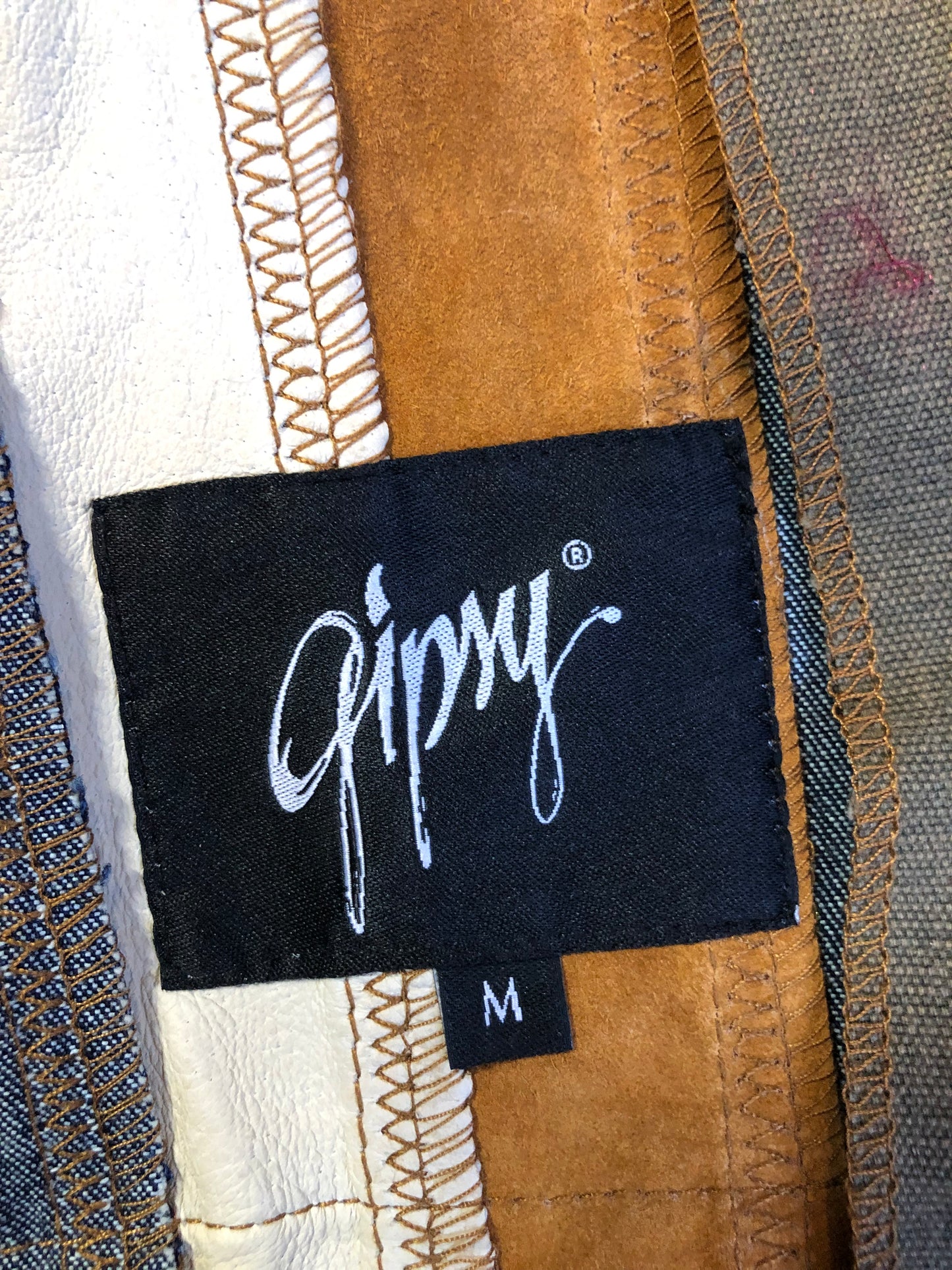 Kingspier Vintage - Very rare vintage 1970’s Gipsy Mauritius leather, suede and cotton patchwork jacket with zipper closure and patch pockets. Size small.