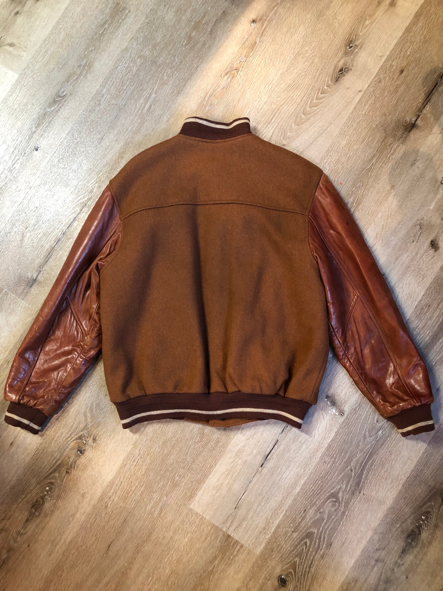 Kingspier Vintage - Rumors and Gossyp brown wool blend varsity style jacket with very soft leather sleeves, snap closures, vertical pockets, knit trim and quilted lining. Made in Canada. Size small.
