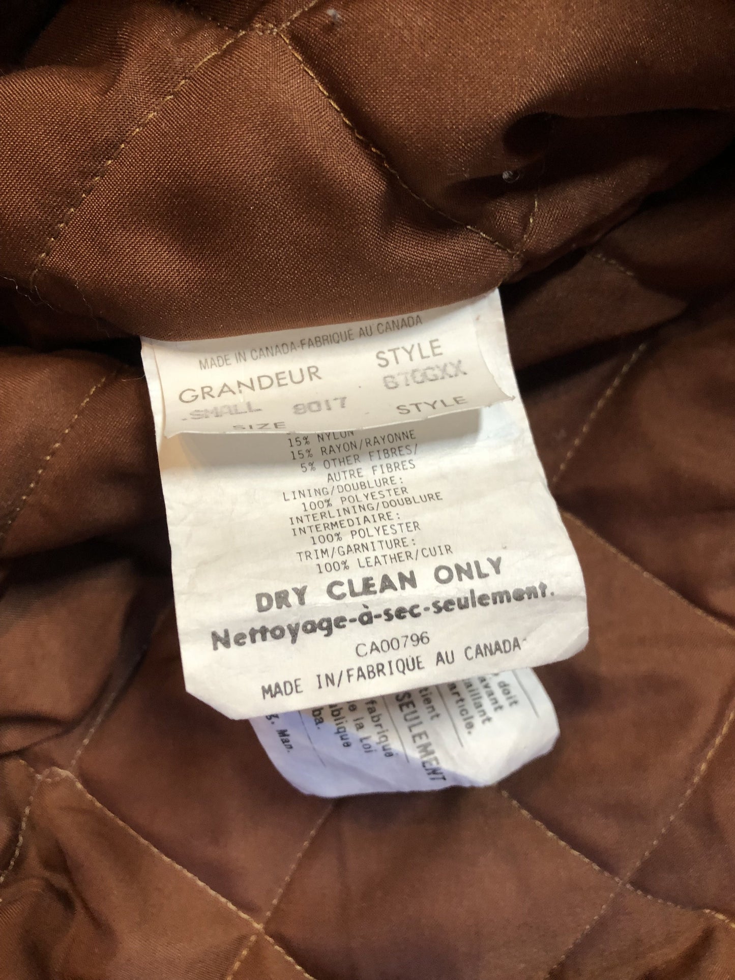 Kingspier Vintage - Rumors and Gossyp brown wool blend varsity style jacket with very soft leather sleeves, snap closures, vertical pockets, knit trim and quilted lining. Made in Canada. Size small.