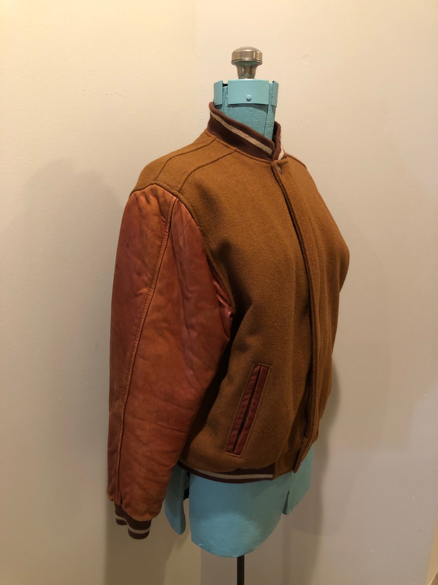 Kingspier Vintage - Rumors and Gossyp brown wool blend varsity style jacket with very soft leather sleeves, snap closures, vertical pockets, knit trim and quilted lining. Made in Canada. Size small.