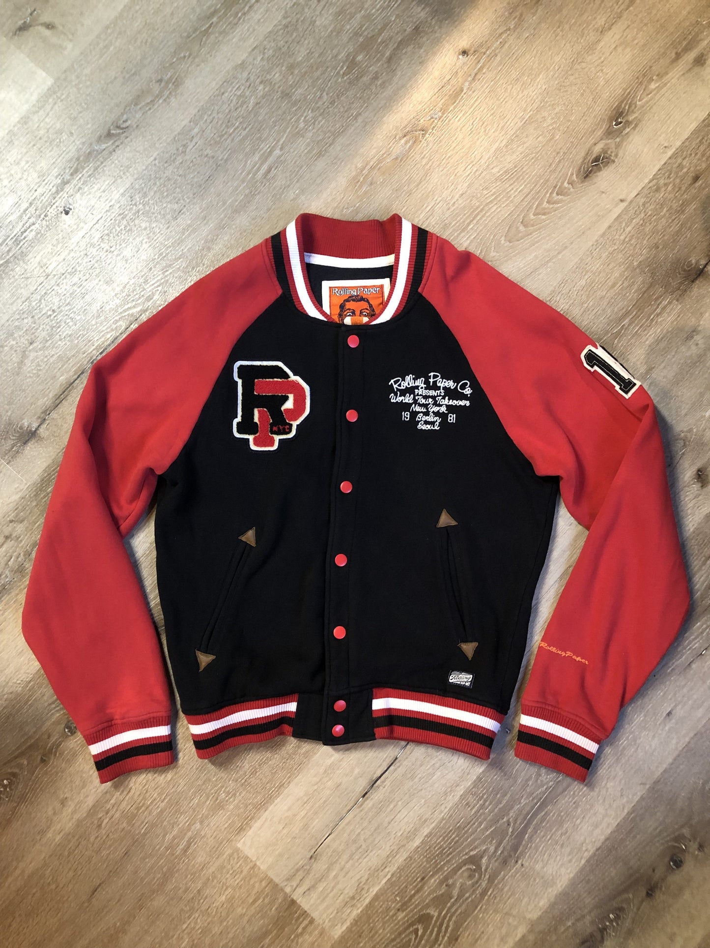 Kingspier Vintage - Vintage 1980’s Rolling Paper Co. varsity style jacket with snap closures and slash pockets. Cotton/ polyester blend. Size medium.