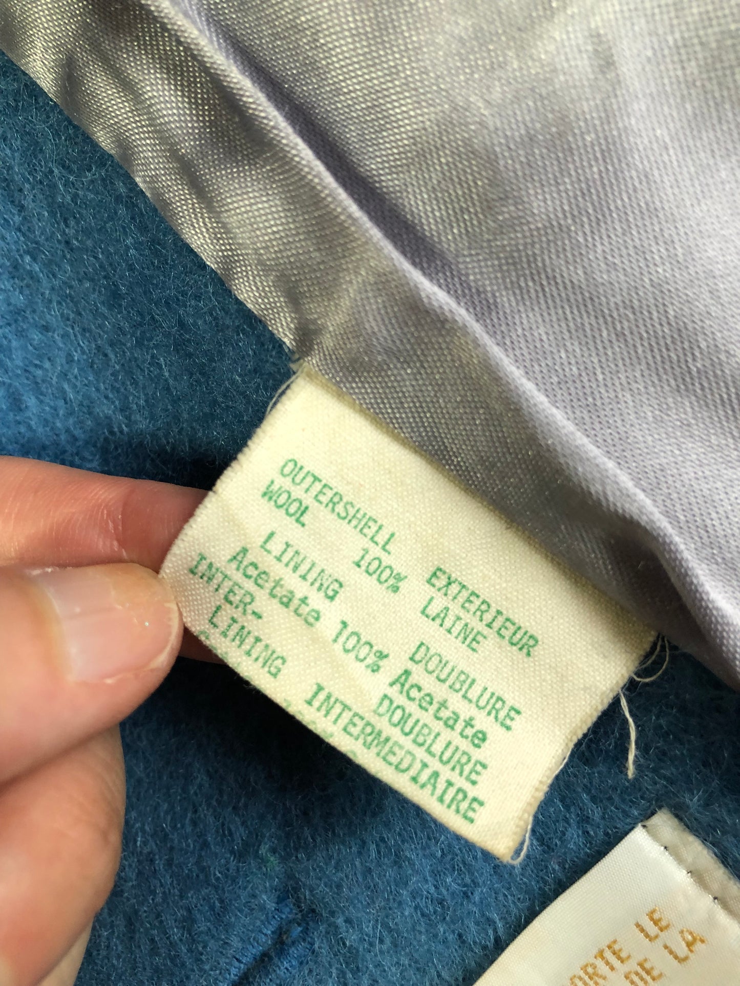 Kingspier Vintage - Hudson’s Bay Company blue and black stripe 100% virgin wool point blanket coat in a swing coat style with belt, buckle detail at the collar, button closures, slash pockets and blue satin lining. Made in England. Size large.