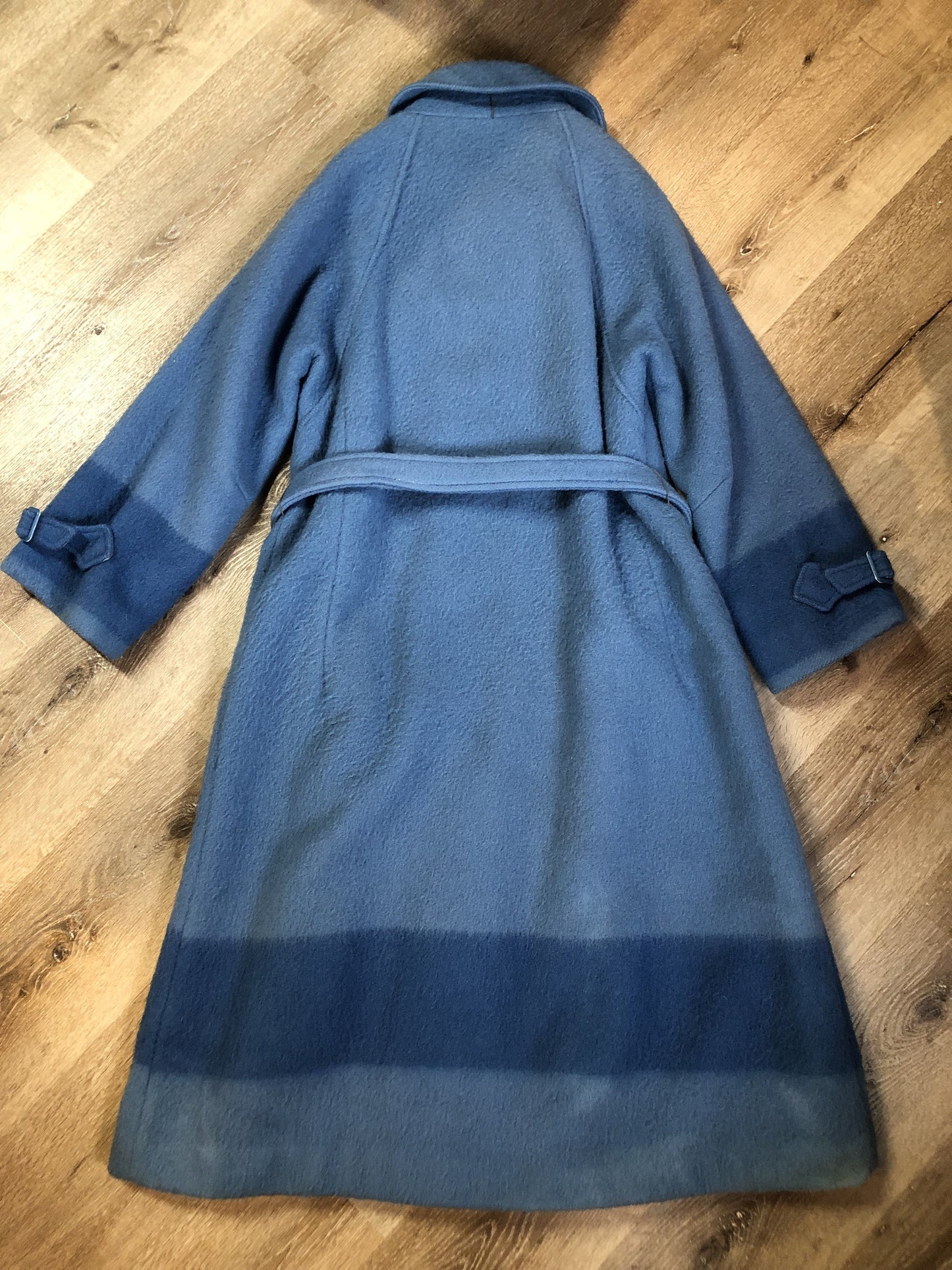 Kingspier Vintage - Hudson’s Bay Company blue and black stripe 100% virgin wool point blanket coat in a swing coat style with belt, buckle detail at the collar, button closures, slash pockets and blue satin lining. Made in England. Size large.
