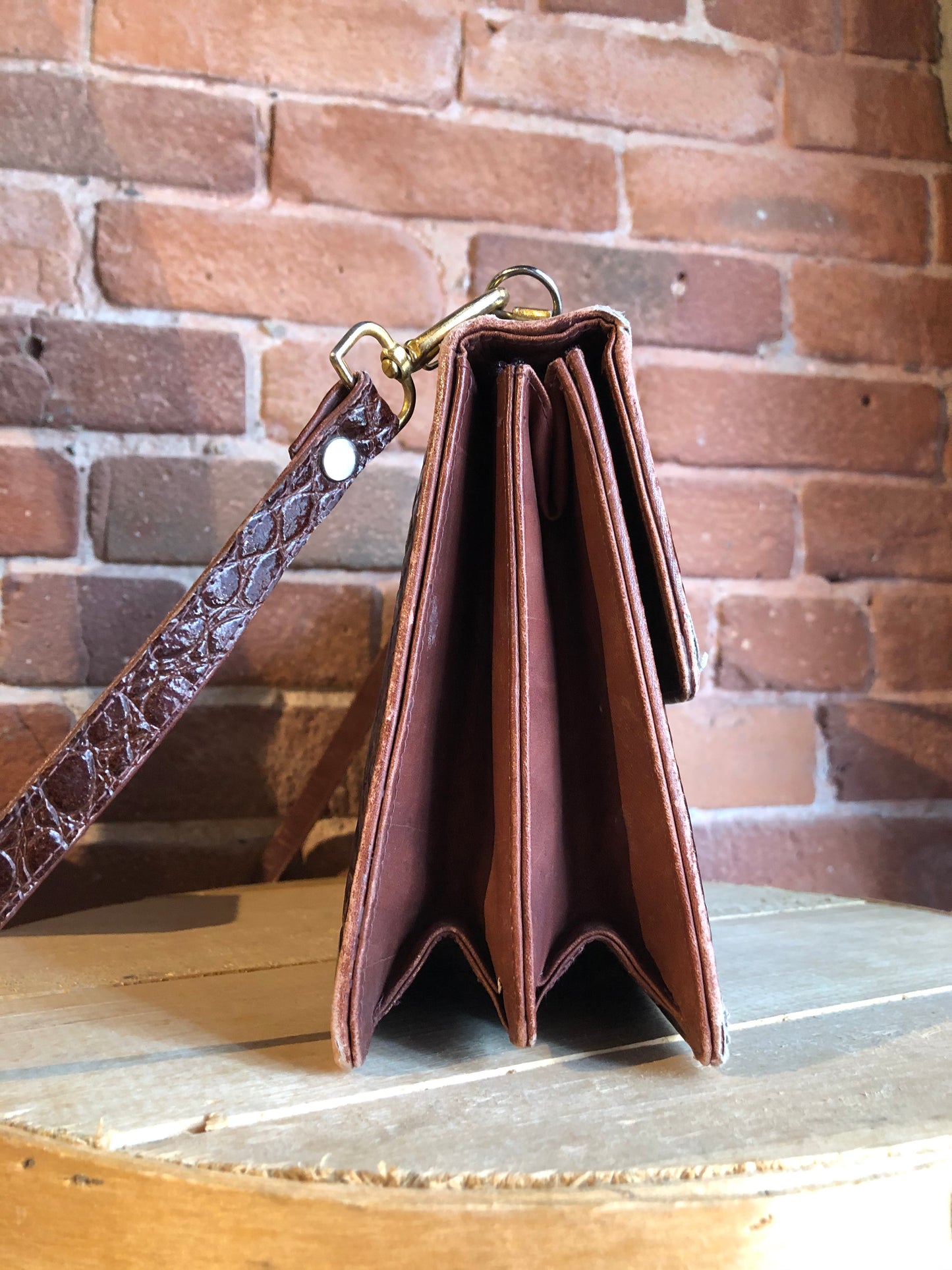 Kingspier Vintage - Dark brown reptile handbag with top handle, brass hardware, push button front clasp, detachable shoulder strap, inside pockets and leather lining.