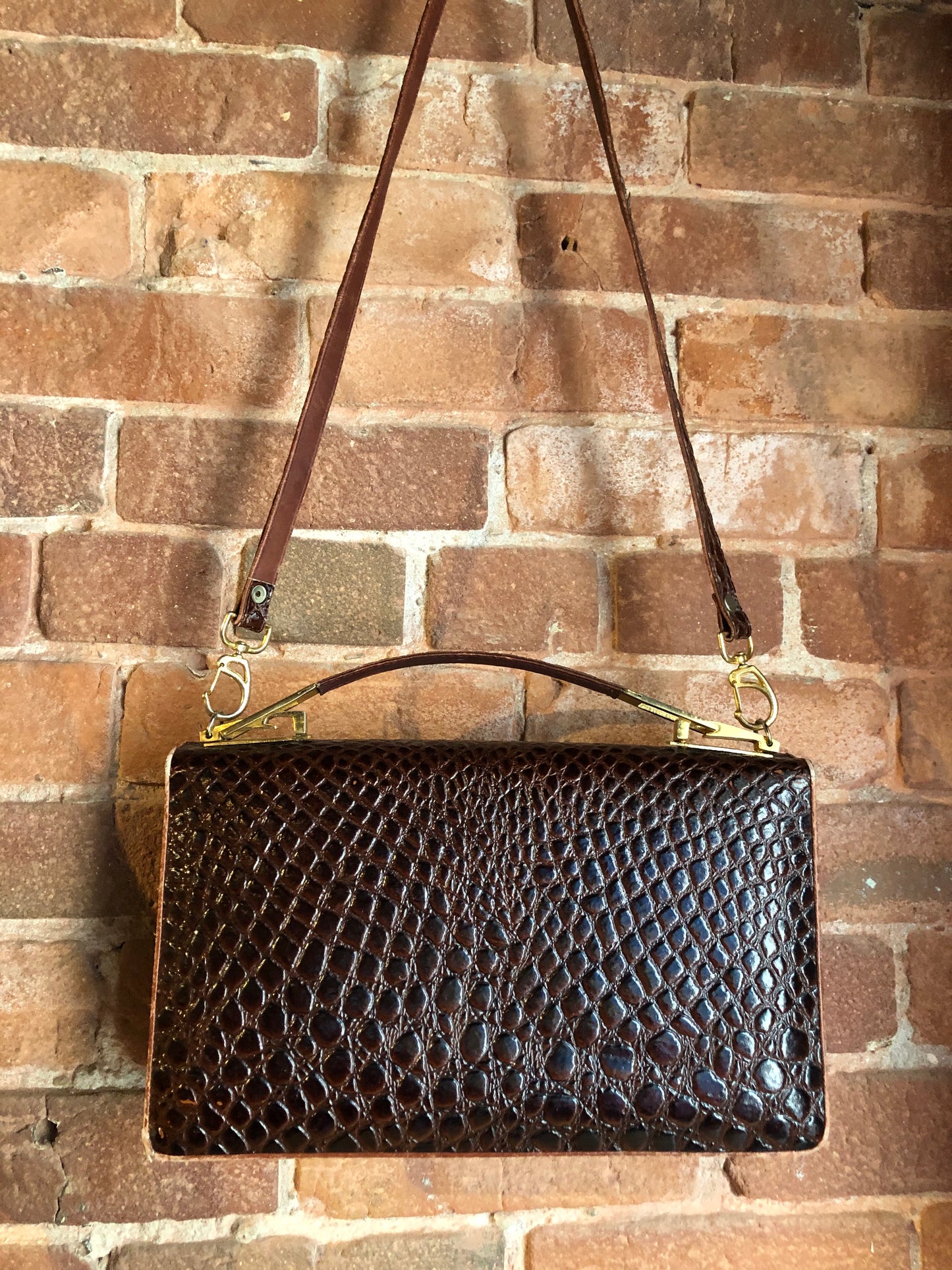 Kingspier Vintage - Dark brown reptile handbag with top handle, brass hardware, push button front clasp, detachable shoulder strap, inside pockets and leather lining.