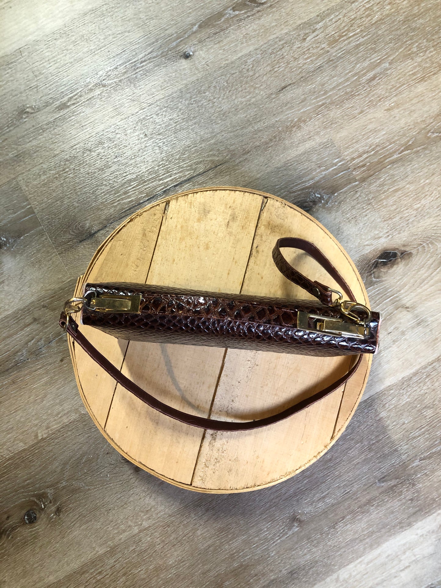 Kingspier Vintage - Dark brown reptile handbag with top handle, brass hardware, push button front clasp, detachable shoulder strap, inside pockets and leather lining.