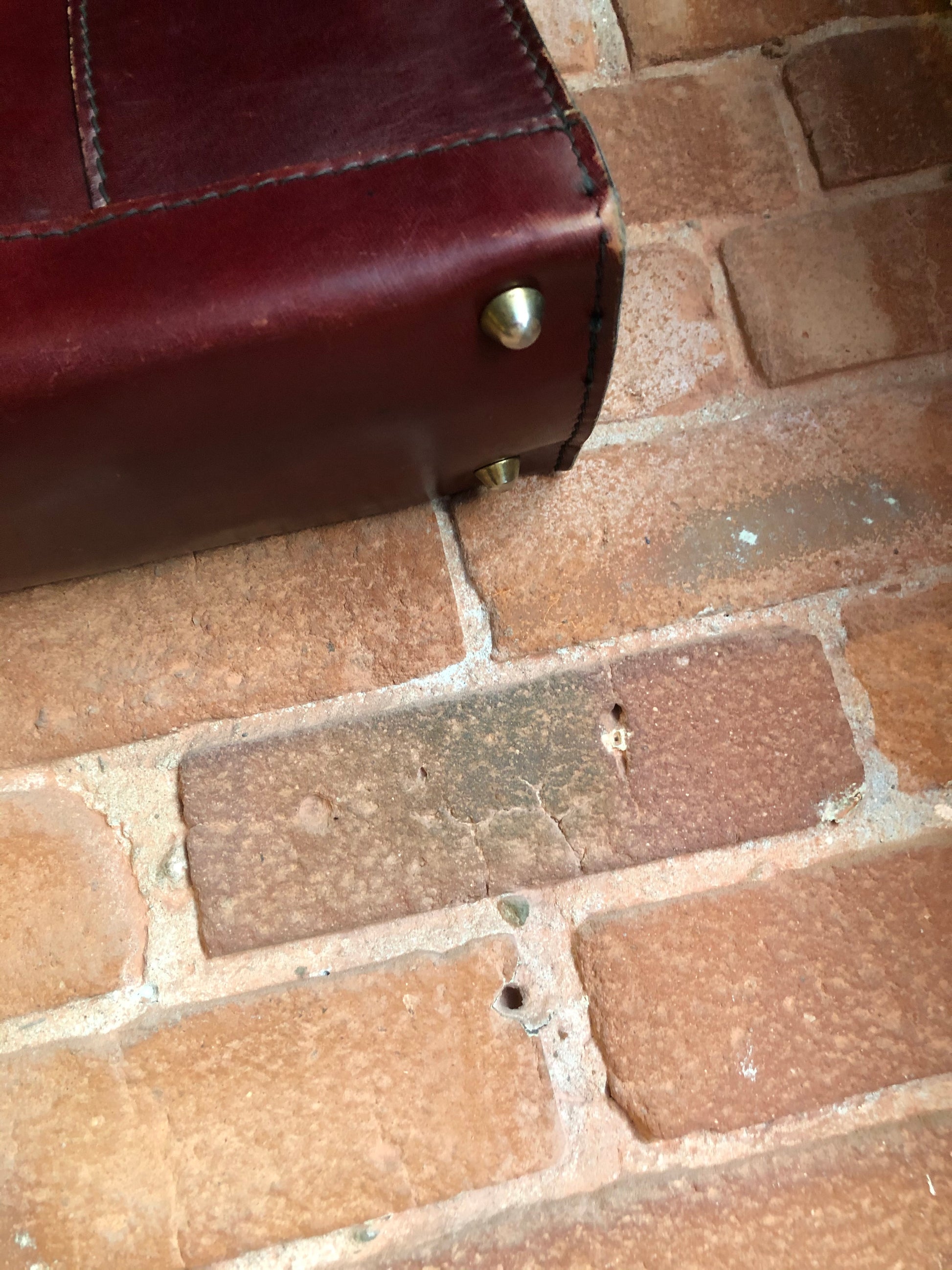 Kingspier Vintage - Caggiano deep red calfskin leather purse with brass hardware, two buckles on each side to allow the top to open fully, inside dividers and pockets. Made in Italy.