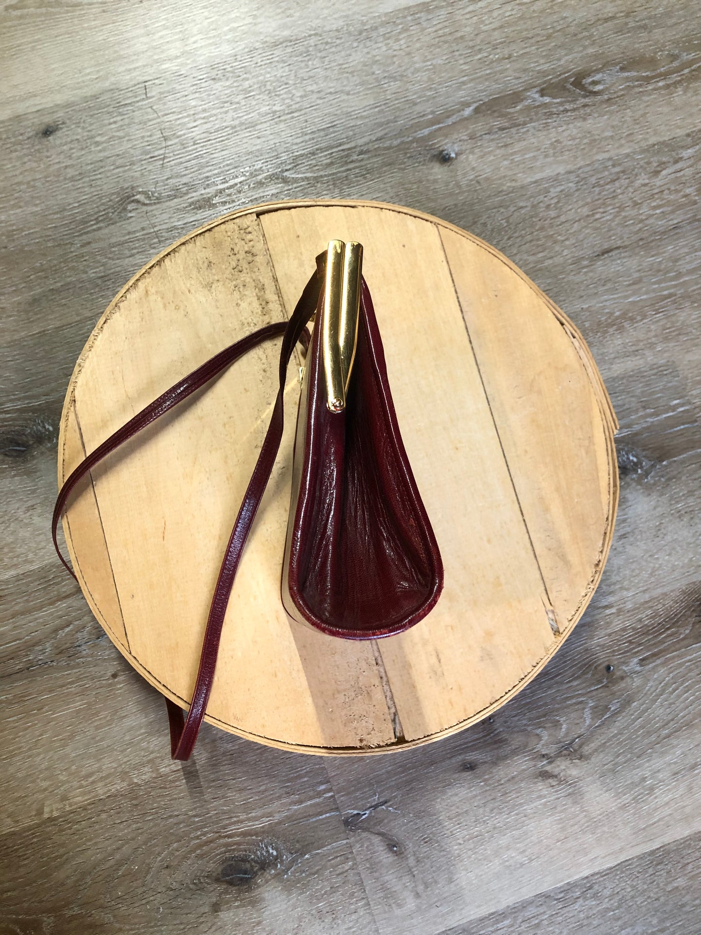 Kingspier Vintage - Deep red leather handbag circa 1950’s with brass metal details and clasp.