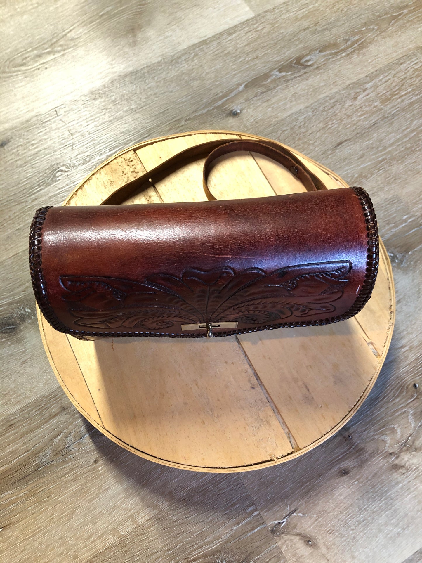 Kingspier Vintage - Hand tooled brown leather purse with leather stitching around the trim and a red leather flower motif lining.