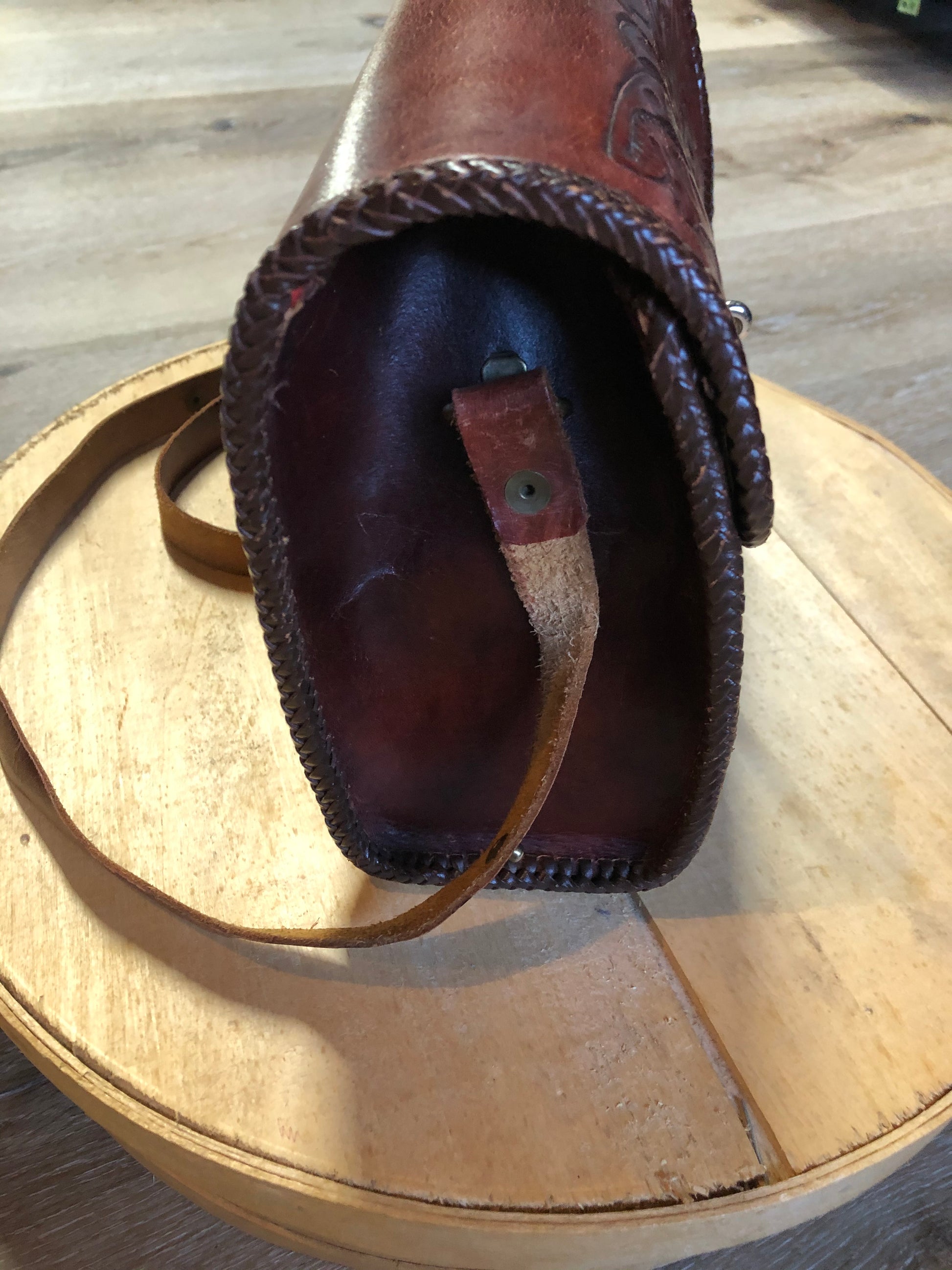 Kingspier Vintage - Hand tooled brown leather purse with leather stitching around the trim and a red leather flower motif lining.