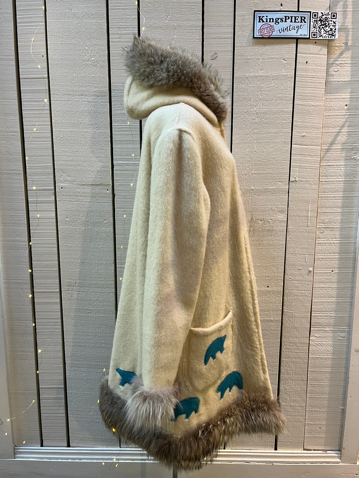 Vintage white 100% wool northern parka, with zipper closure, patch pockets, fur trim and felt applique details.
Indigenous made
Chest 48”