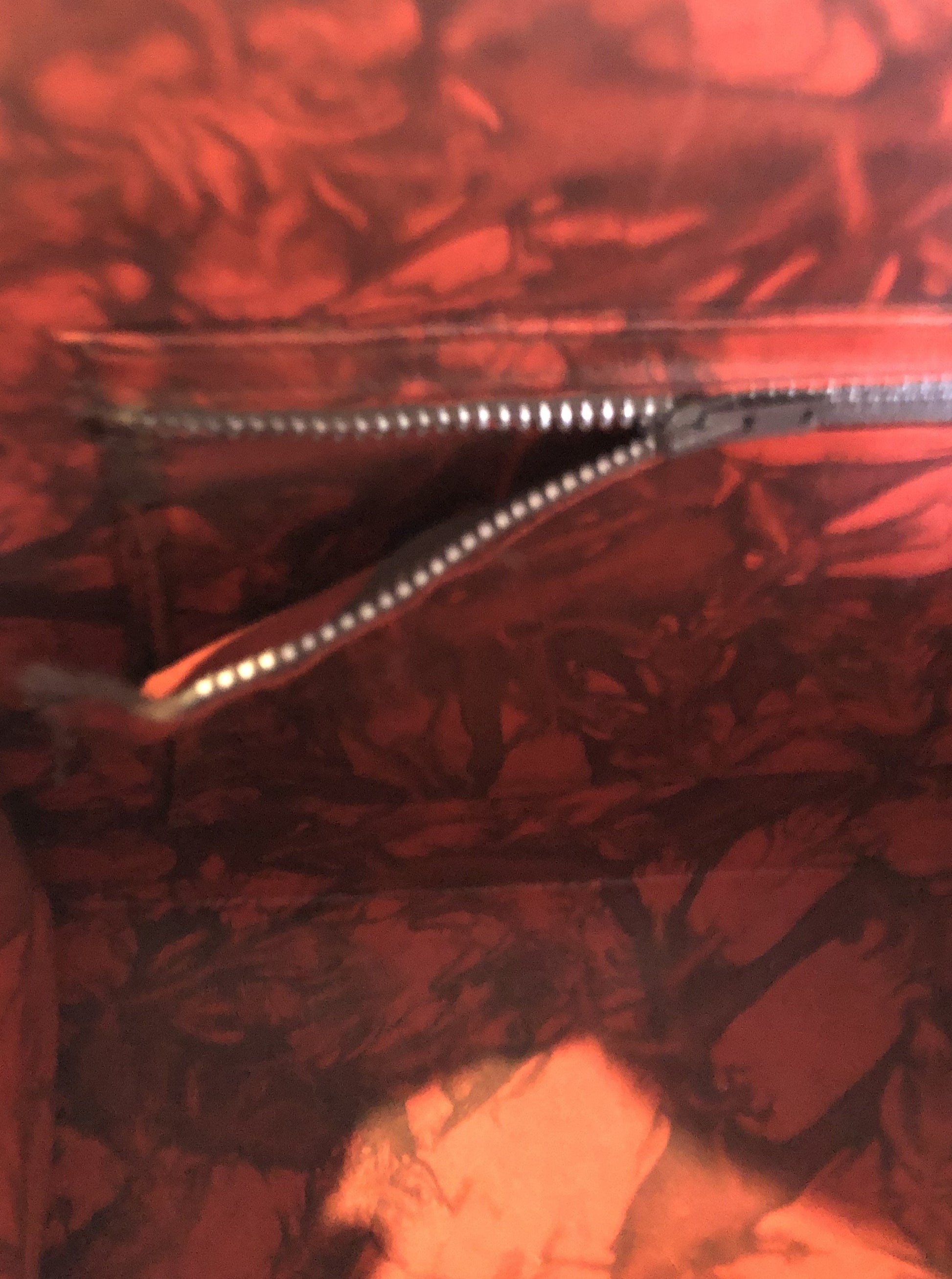 Kingspier Vintage - Hand tooled brown leather purse with leather stitching around the trim and a red leather flower motif lining.