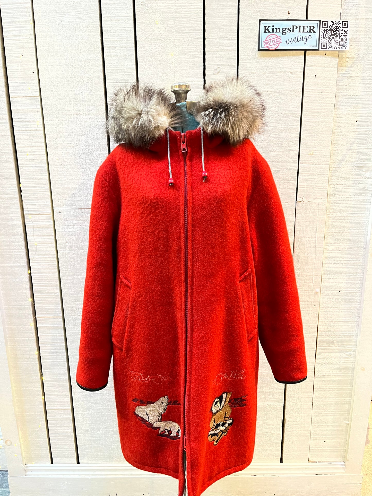 Vintage Central Sportswear Co. red 100% pure virgin wool northern parka with zipper closure, handwarmer pockets, quilted lining, fur trimmed hood and embroidered northern life motif.
Made in Canada
Size 12