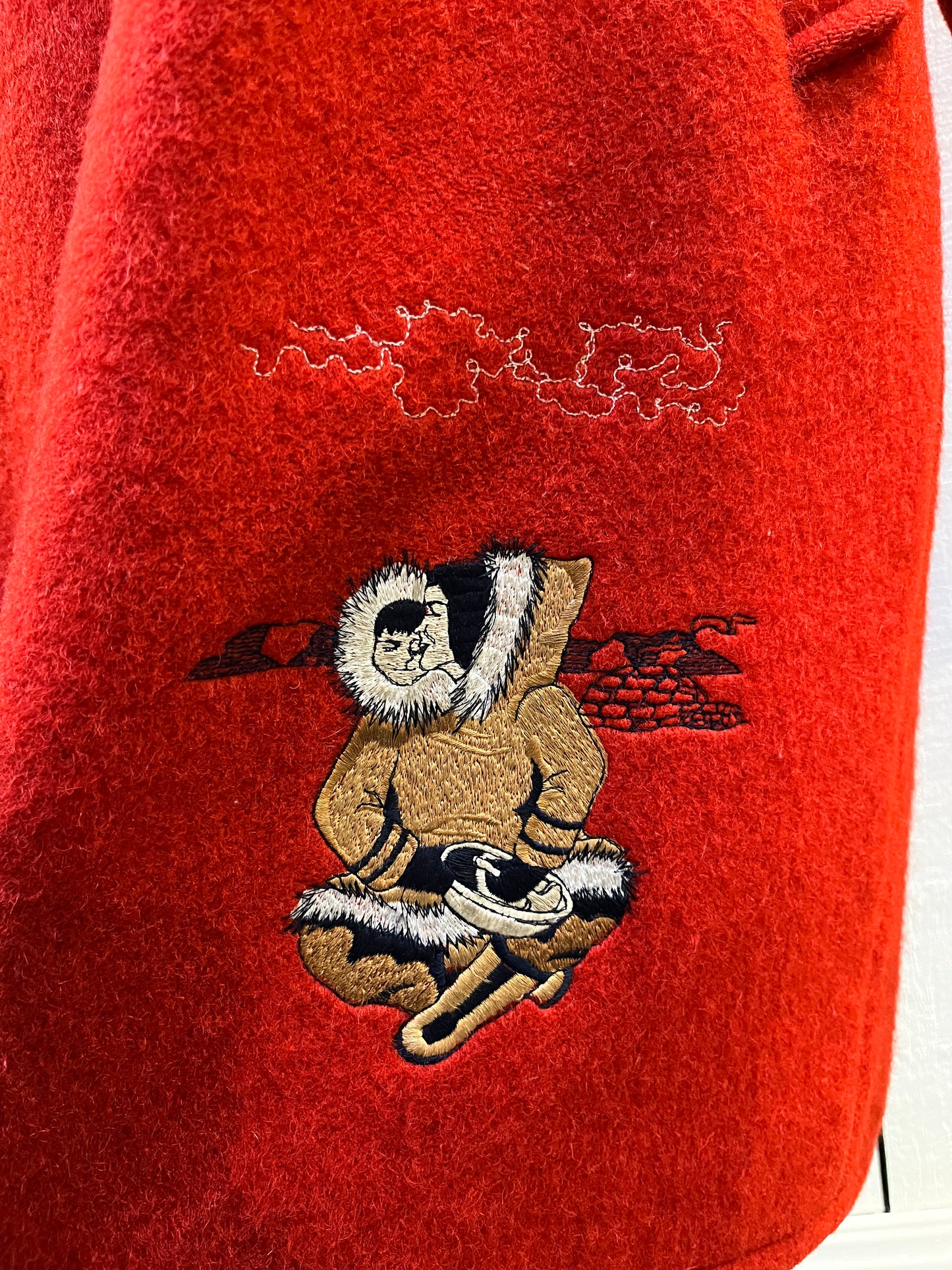 Vintage Central Sportswear Co. red 100% pure virgin wool northern parka with zipper closure, handwarmer pockets, quilted lining, fur trimmed hood and embroidered northern life motif.
Made in Canada
Size 12