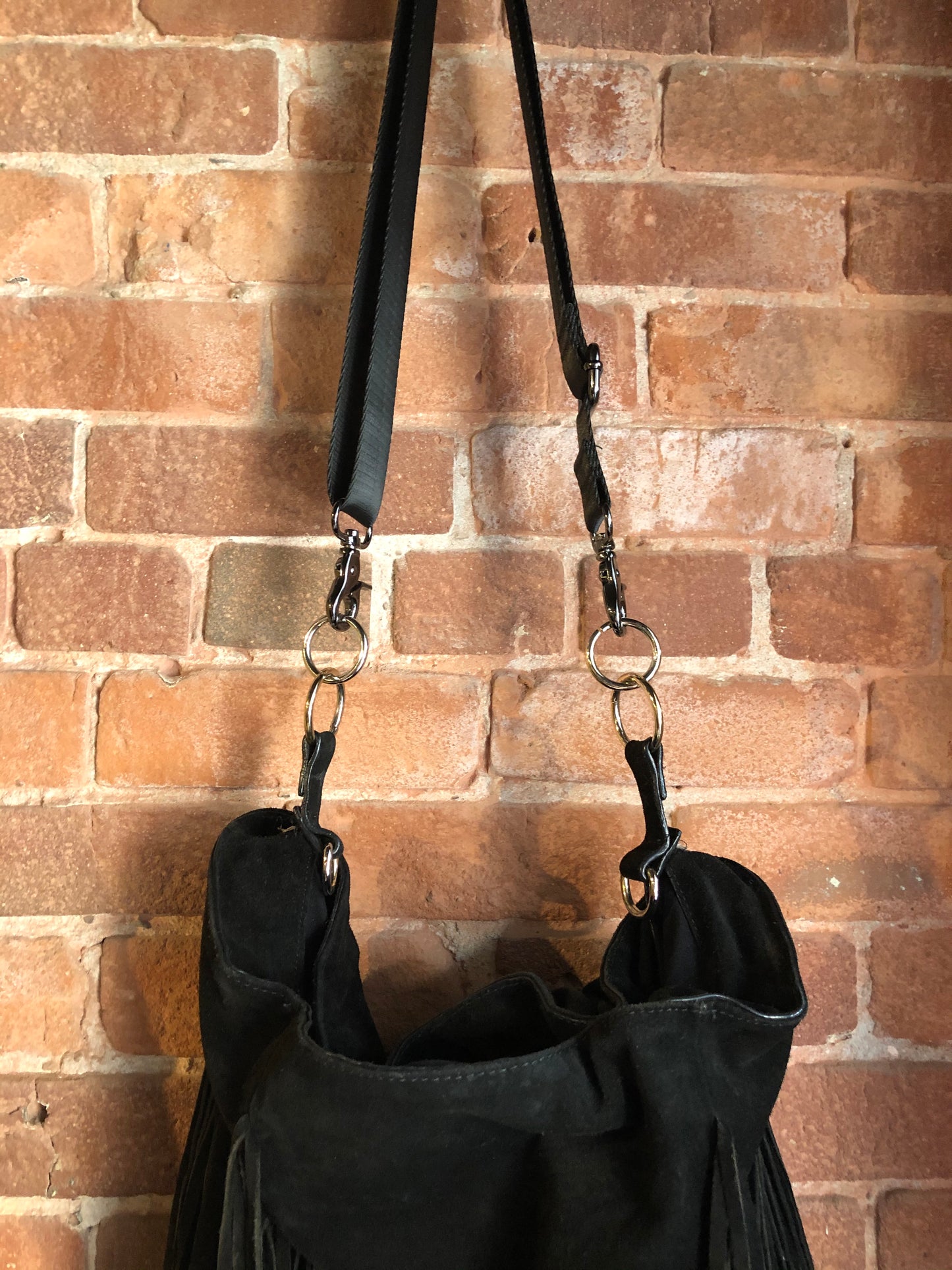Kingspier Vintage - Zara black suede fringe crossbody bag with magnetic closures and adjustable strap.