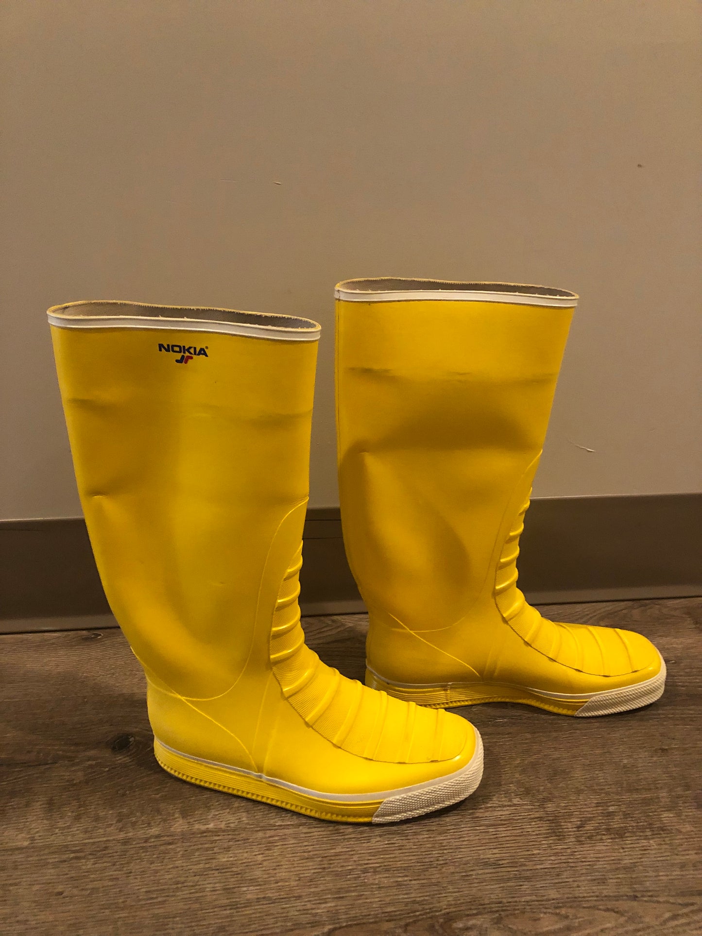 Original Nokia yellow and white rubber sailing boots circa 1980’s are handmade in Finland by the same company that makes cell phones. Nokia no longer makes boots. Size 13M /15W US, 46 EUR