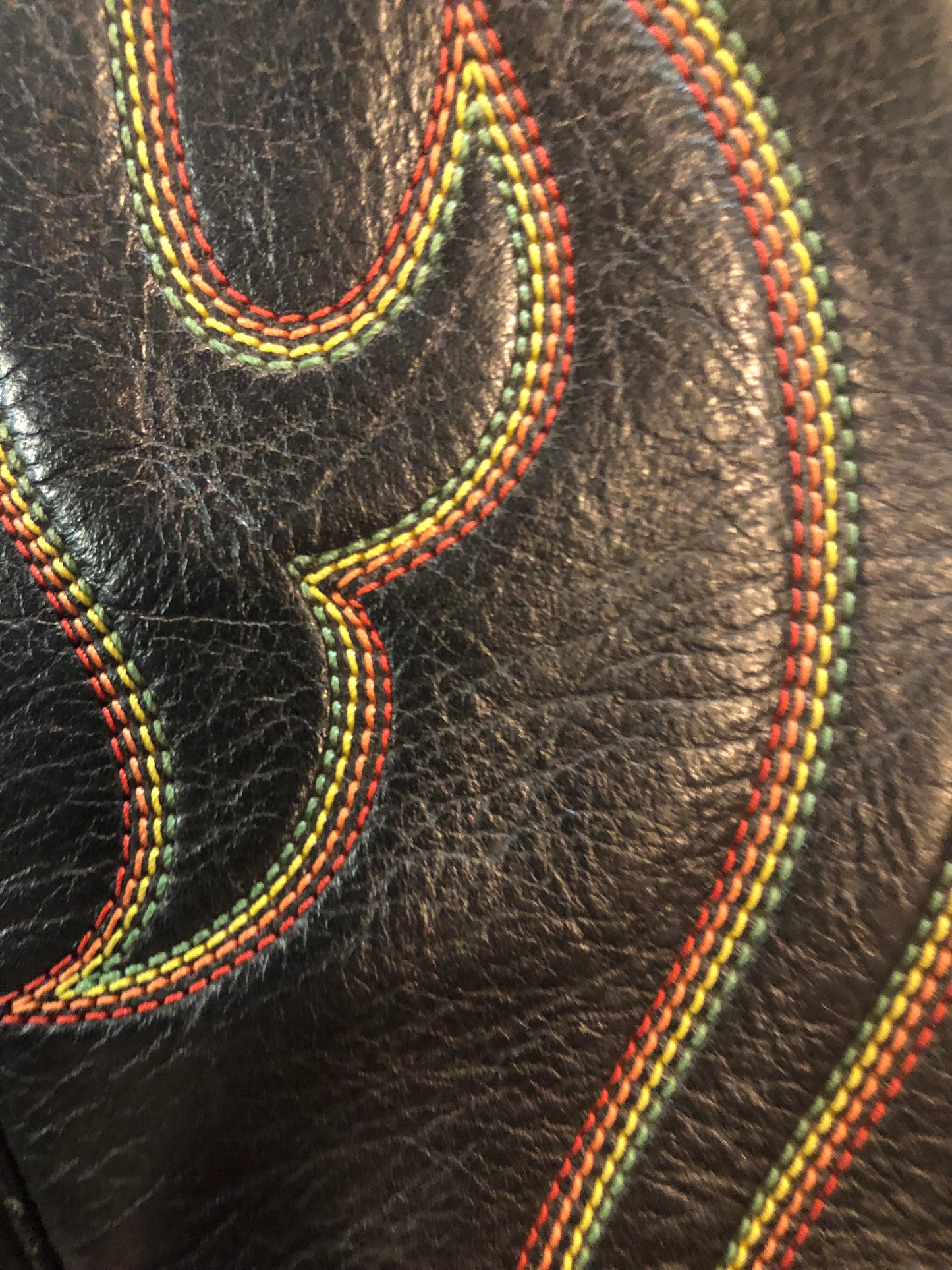 Stewart Co knee high leather cowboy boots in black with rainbow stitching. Leather lined with leather soles. Made in USA Size 7.5W US, 38 EUR