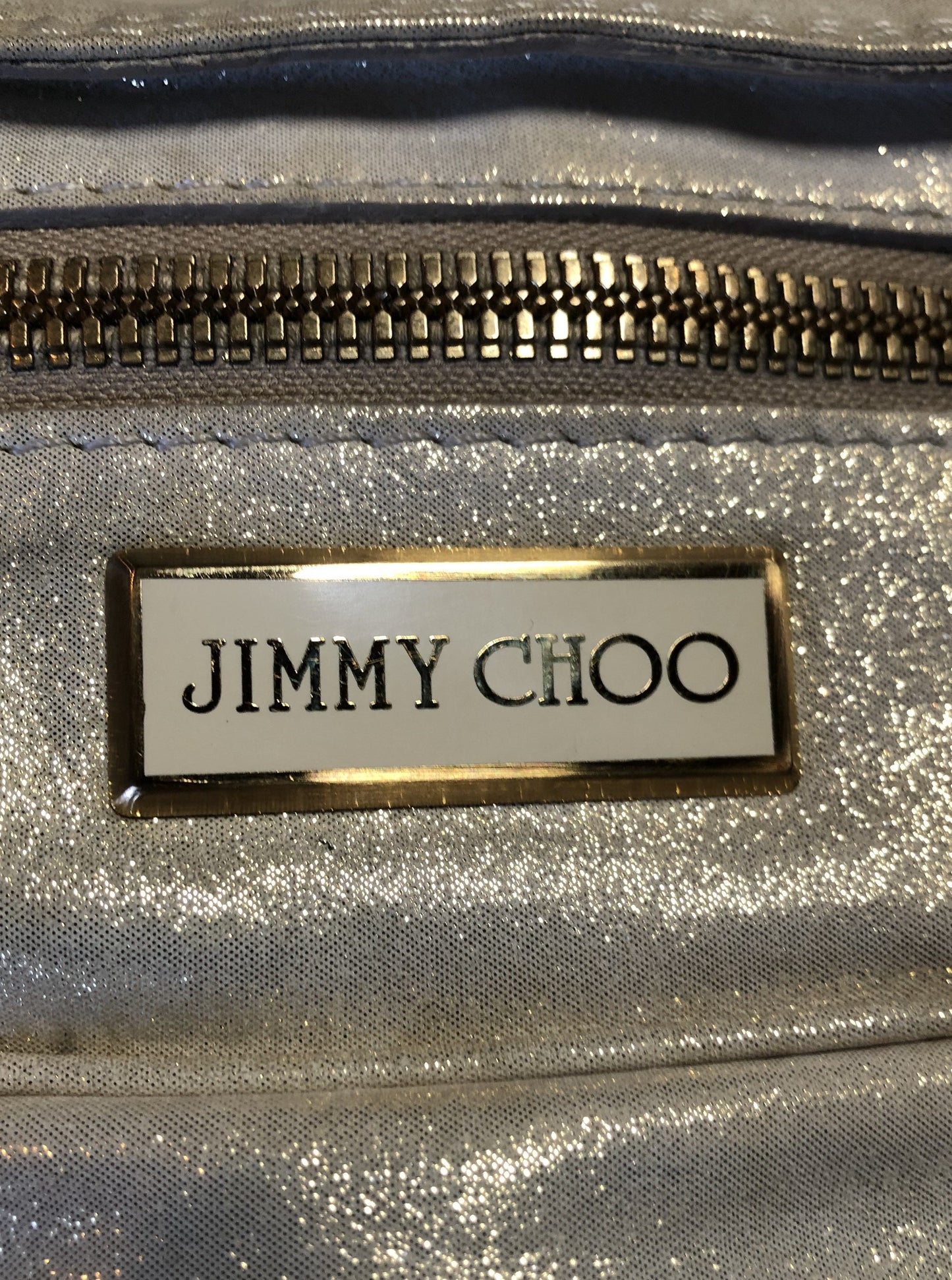 Kingspier Vintage - Authentic Jimmy Choo Melena XL tote in Iridescent white calfskin leather with zip closures, gold hardware and suede lining.