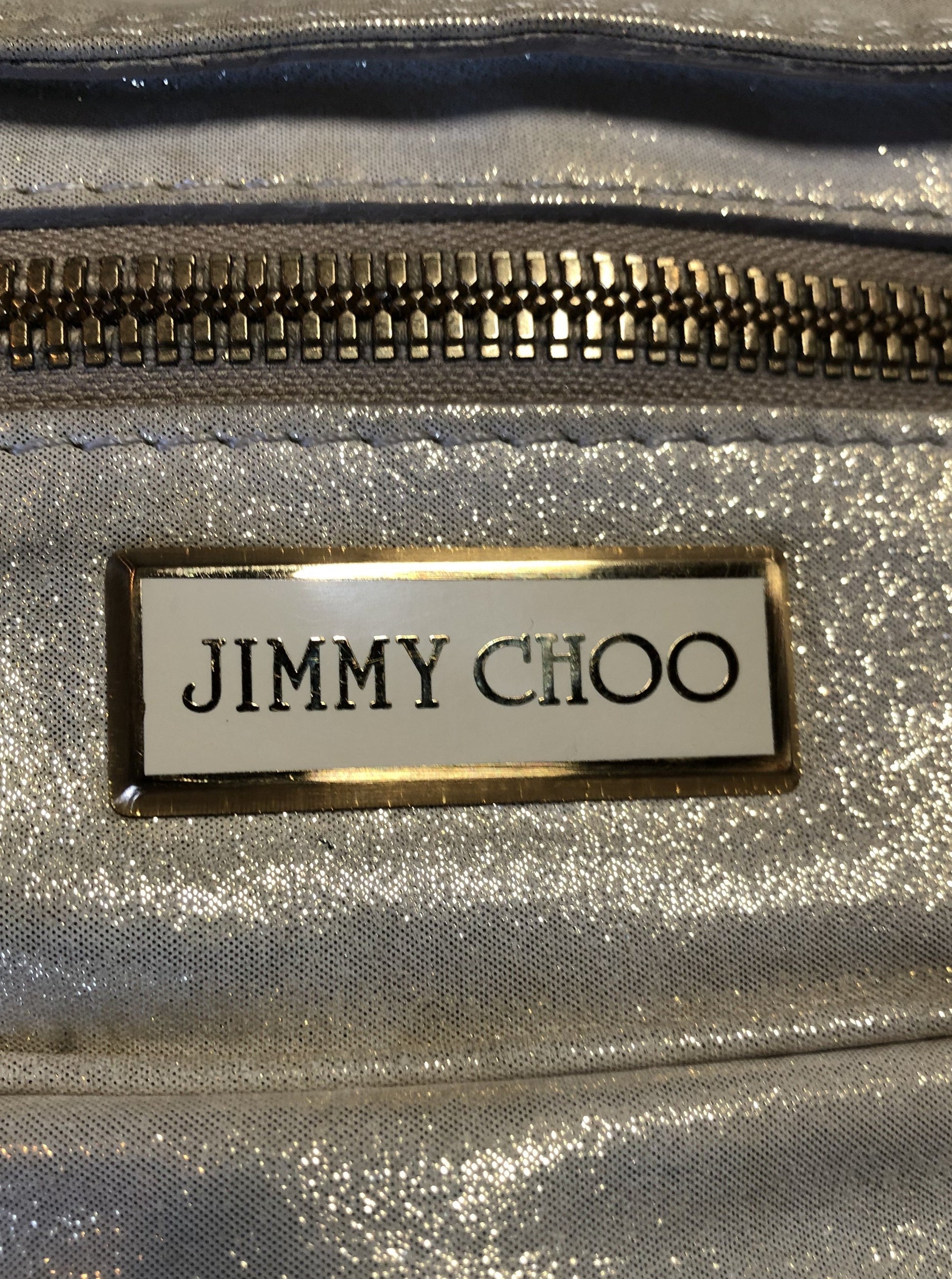 Kingspier Vintage - Authentic Jimmy Choo Melena XL tote in Iridescent white calfskin leather with zip closures, gold hardware and suede lining.