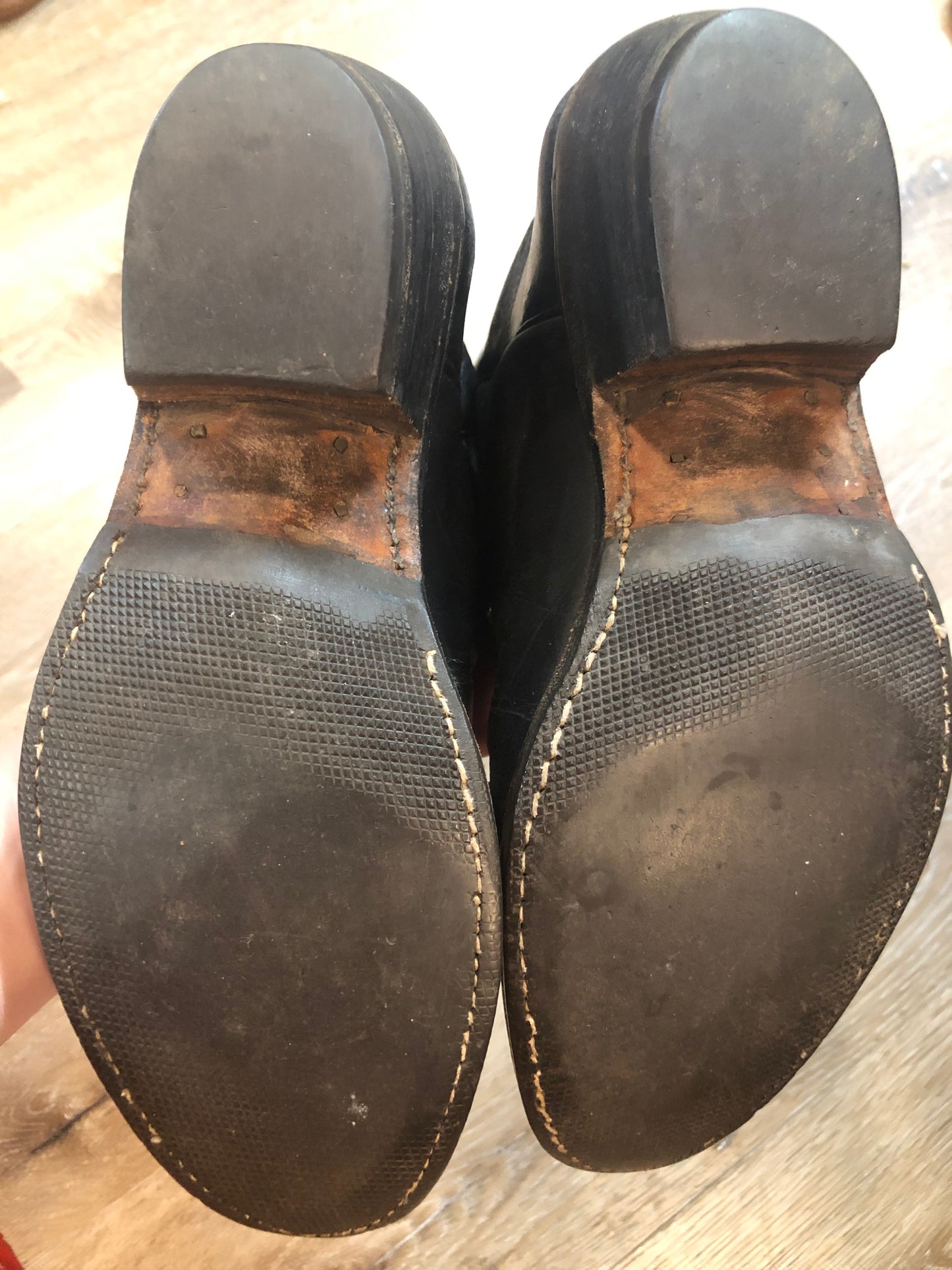 Stewart Co knee high leather cowboy boots in black with rainbow stitching. Leather lined with leather soles. Made in USA Size 7.5W US, 38 EUR