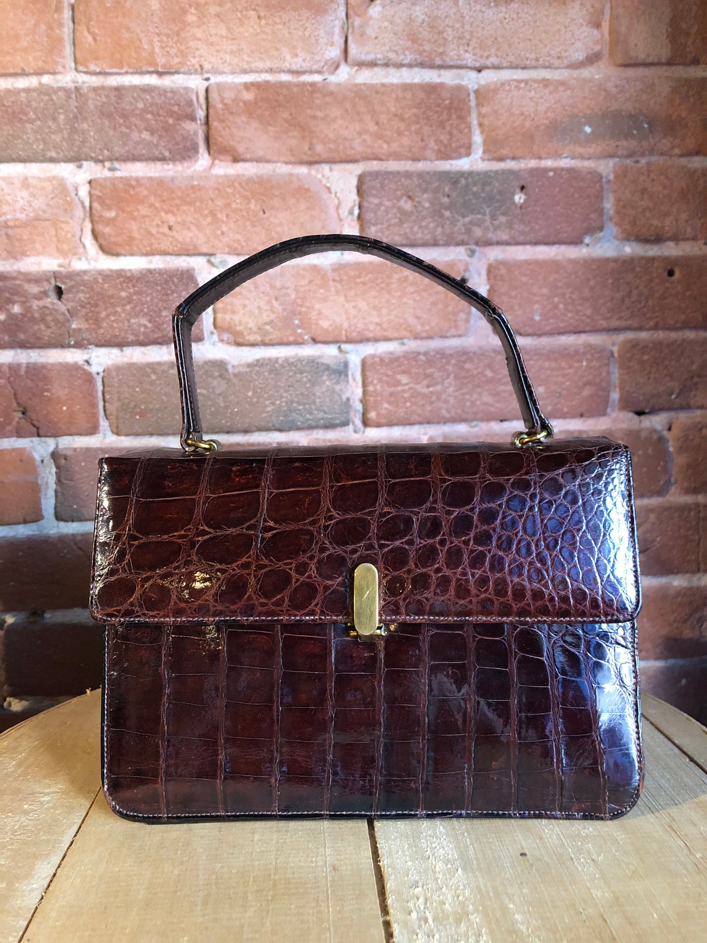 Kingspier Vintage - Bellestone red/brown lizard handbag, circa 1970’s with top handle, leather lining, brass hardware and clasp closure.