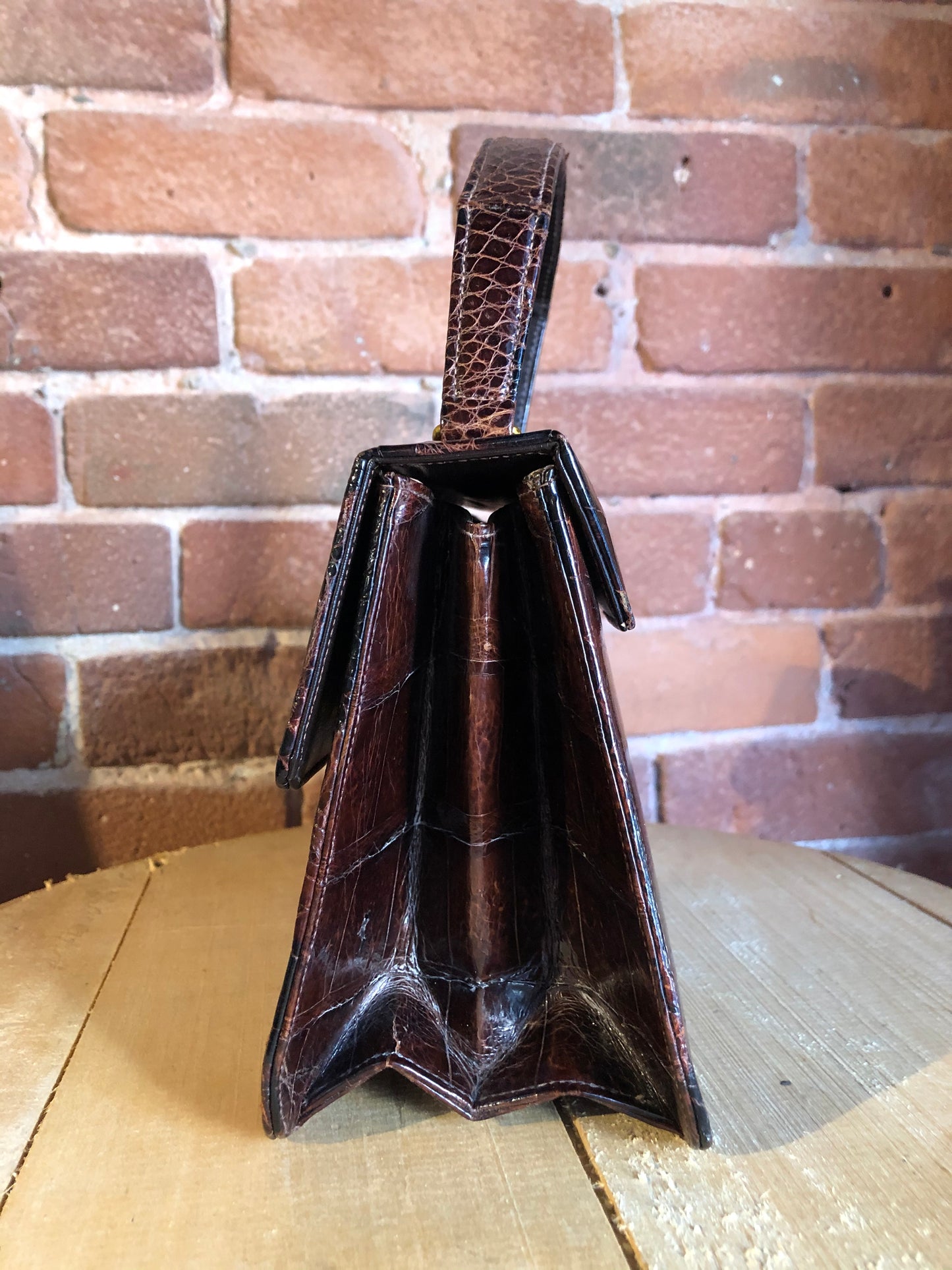 Kingspier Vintage - Bellestone red/brown lizard handbag, circa 1970’s with top handle, leather lining, brass hardware and clasp closure.