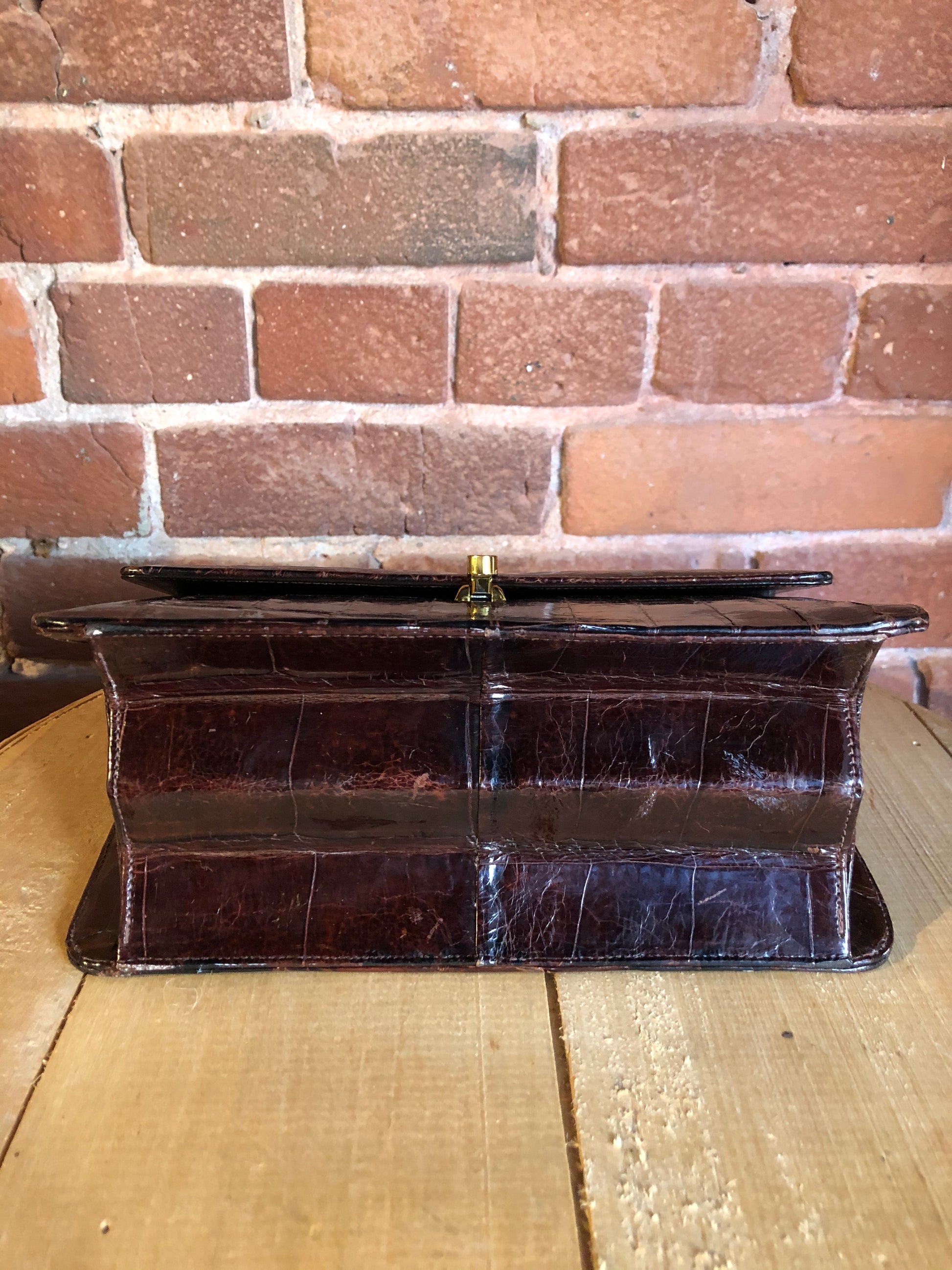 Kingspier Vintage - Bellestone red/brown lizard handbag, circa 1970’s with top handle, leather lining, brass hardware and clasp closure.