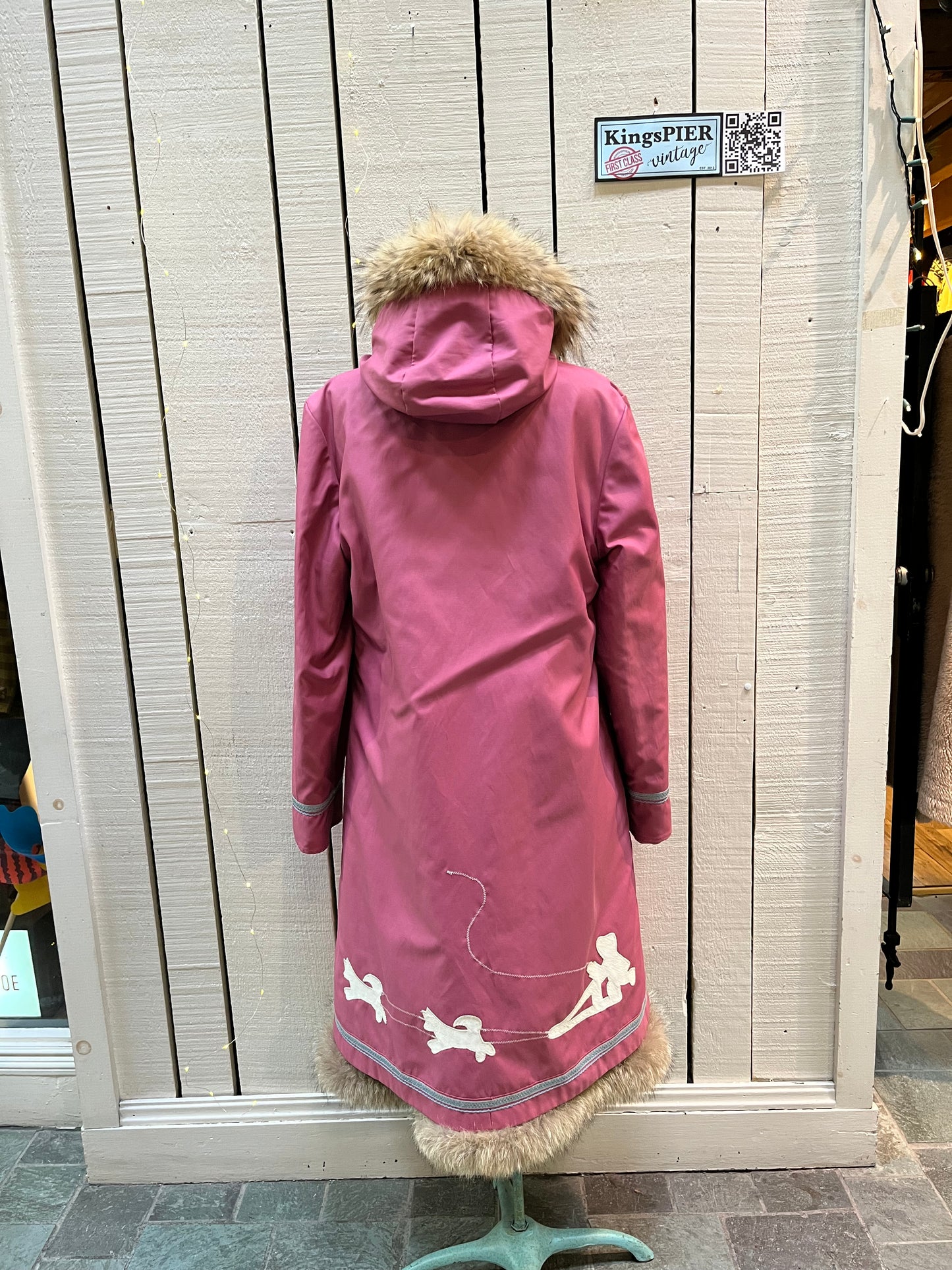 Vintage Yukon Indian Arts and Crafts LTD 100% pure virgin wool northern parka and nylon/ cotton blend removable shell with white leather applique, fur trimmed hood and pom poms, zipper closure, pockets, and hand embroidered flower details.
Made in USA
Size 16