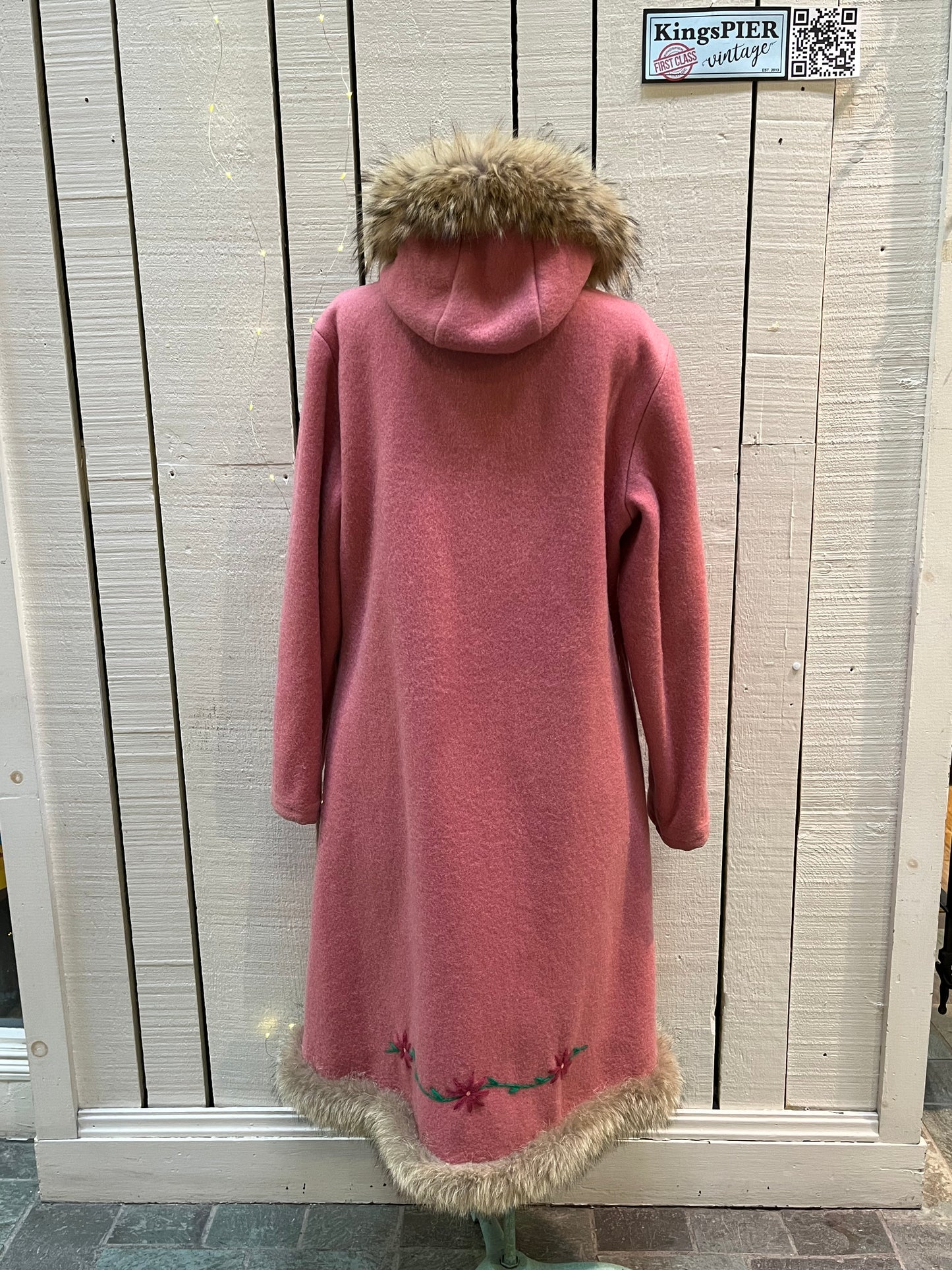 Vintage Yukon Indian Arts and Crafts LTD 100% pure virgin wool northern parka and nylon/ cotton blend removable shell with white leather applique, fur trimmed hood and pom poms, zipper closure, pockets, and hand embroidered flower details.
Made in USA
Size 16