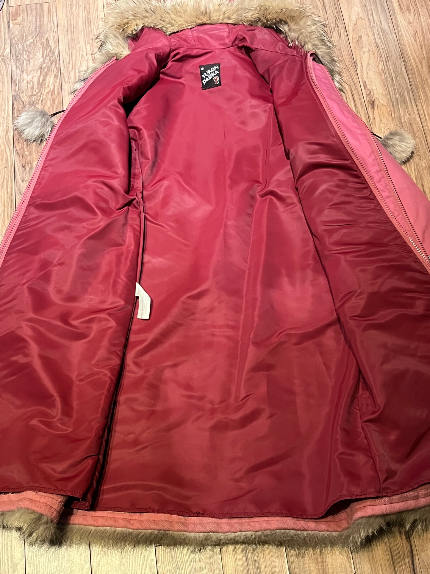 Vintage Yukon Indian Arts and Crafts LTD 100% pure virgin wool northern parka and nylon/ cotton blend removable shell with white leather applique, fur trimmed hood and pom poms, zipper closure, pockets, and hand embroidered flower details.
Made in USA
Size 16