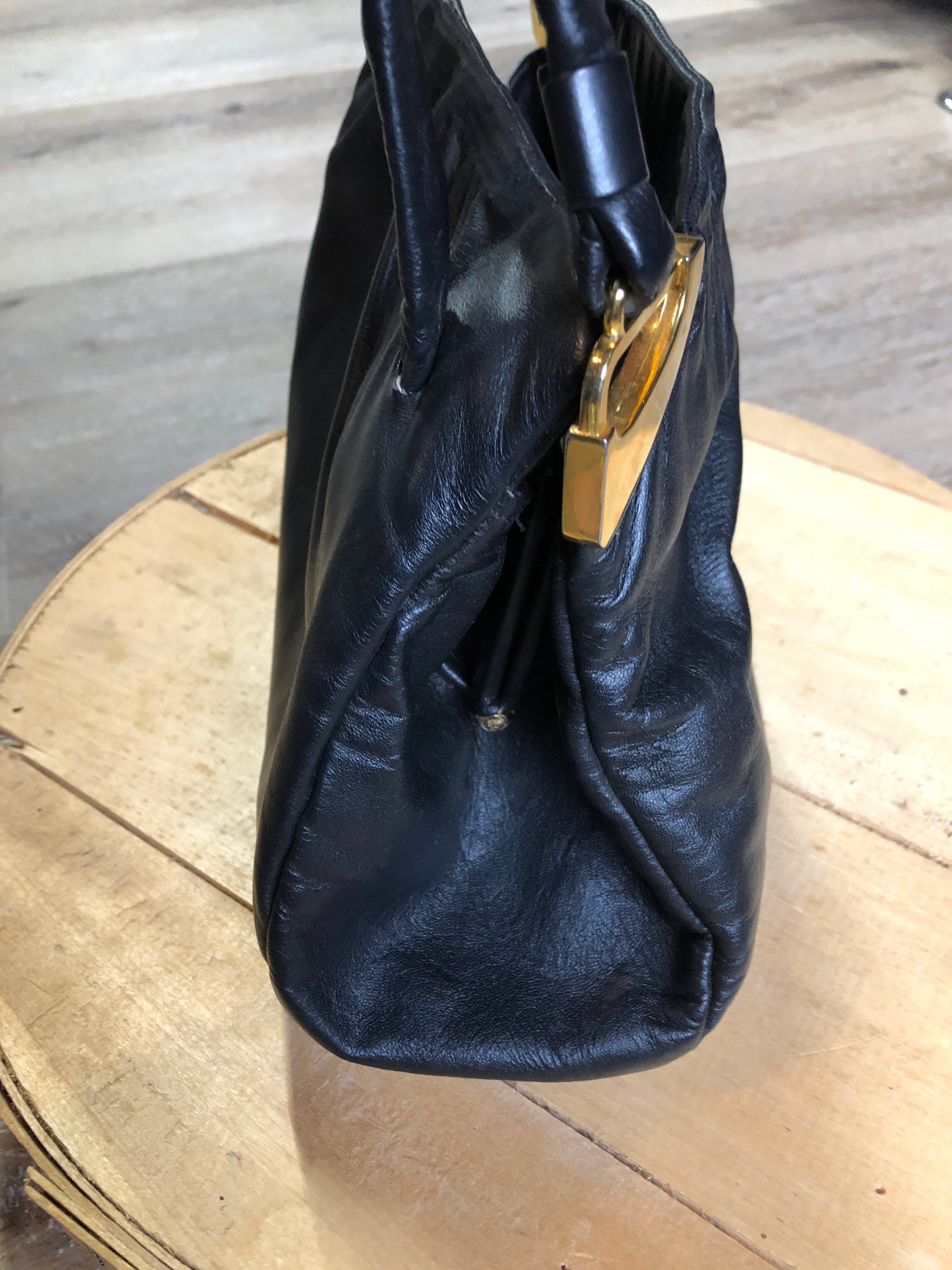 Kingspier Vintage - Jane Shilton black leather handbag with top handle, gold hardware and inside change purse compartment.