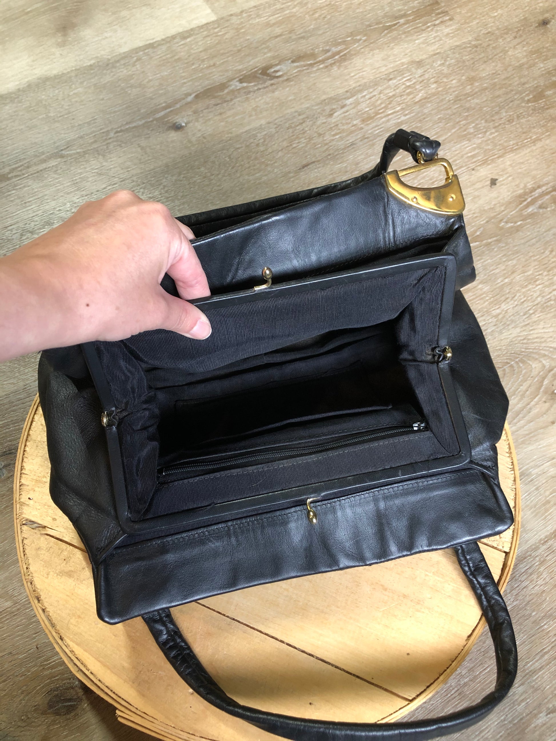 Kingspier Vintage - Jane Shilton black leather handbag with top handle, gold hardware and inside change purse compartment.